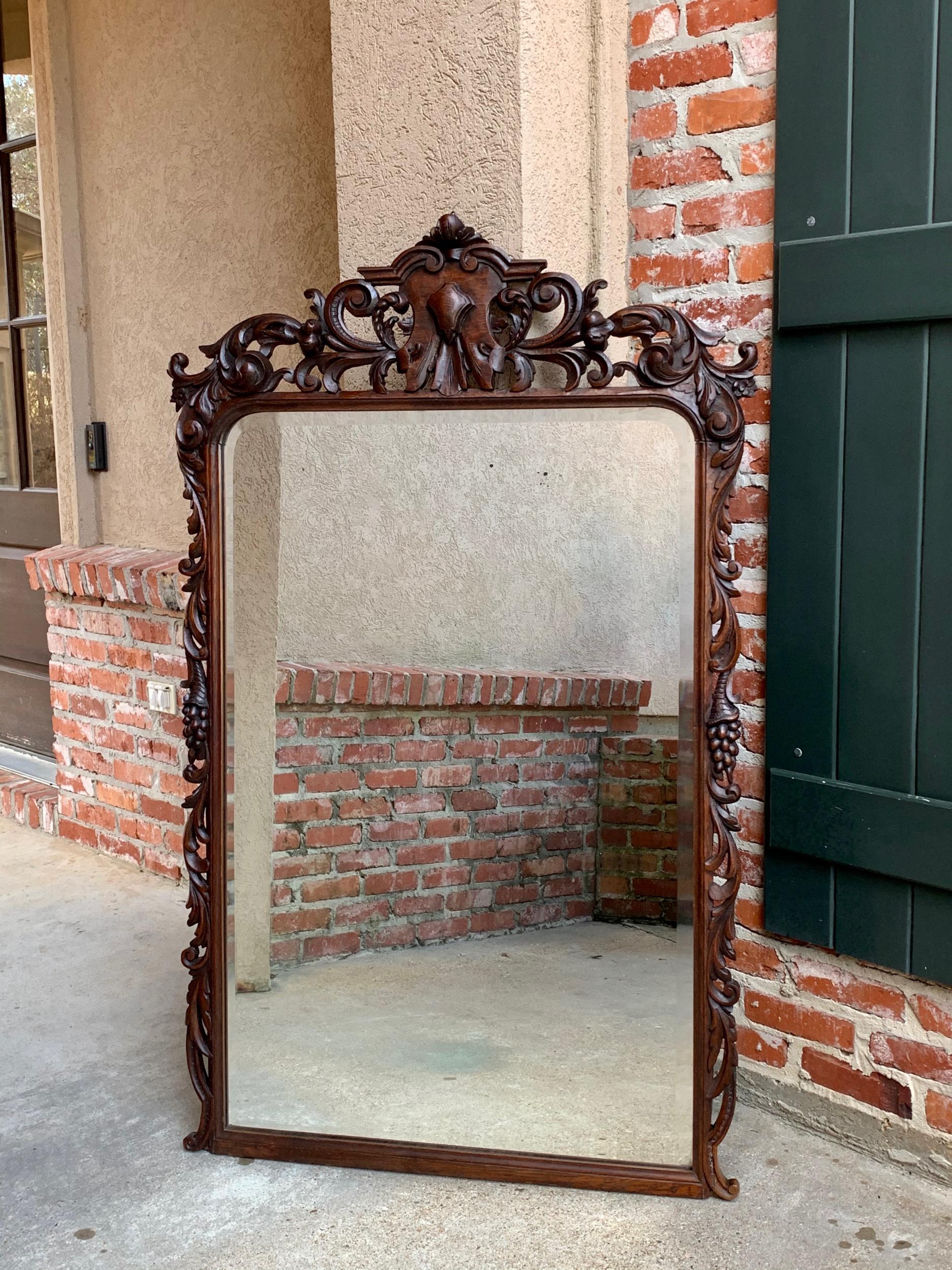 19th century antique French carved oak pier mantel mirror renaissance Louis XIV

~ Direct from France
~ A large and lovely antique French wall mirror, in full pier mirror size
~ Beautiful hand carved designs with amazing craftsmanship
~ Large upper