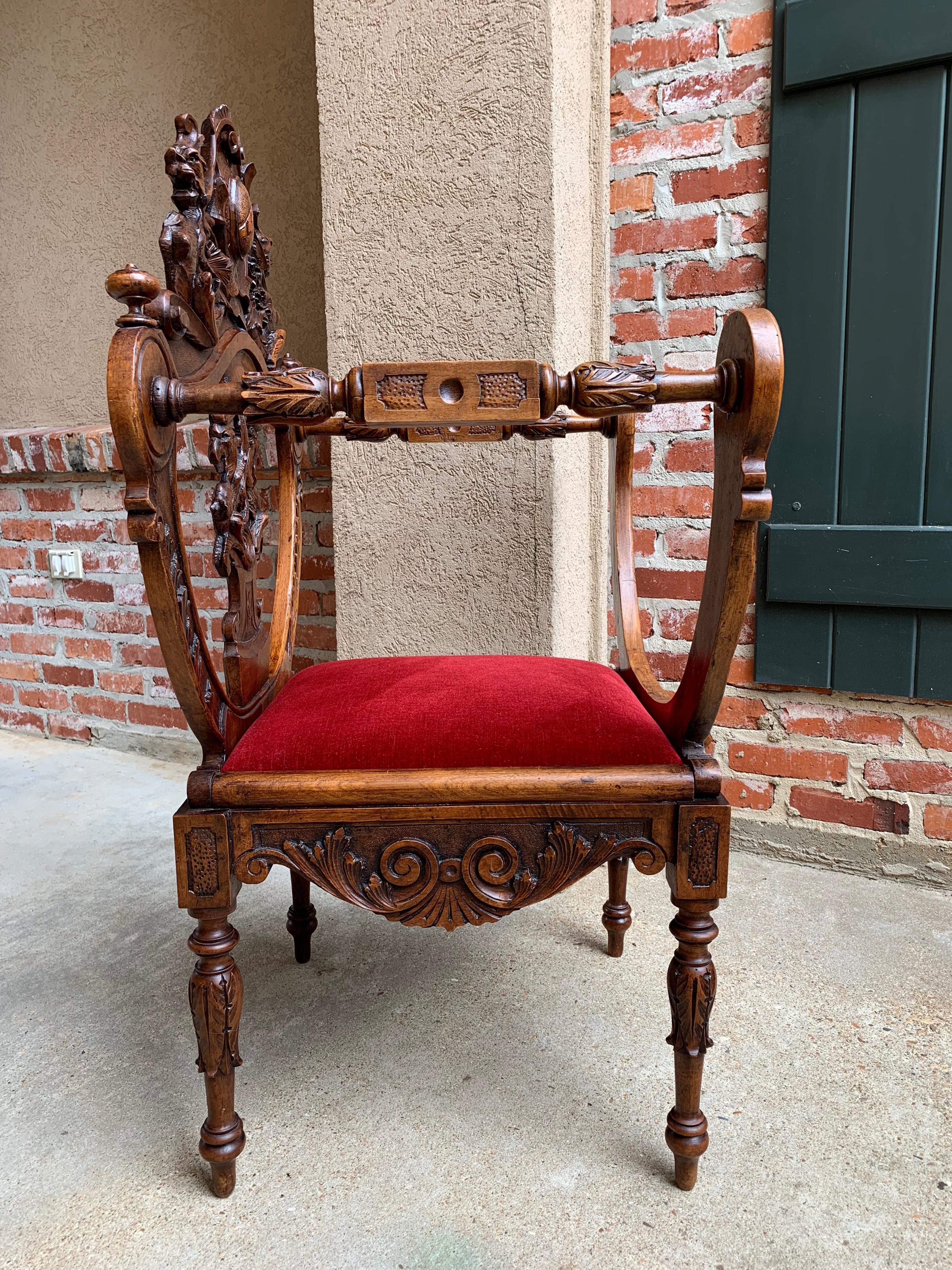 Direct from France, a stunning antique carved “Dagobert” chair with beautifully detailed antique hand carvings from top to bottom.~
~The dagobert throne chair or Curule chair has an amazing history, quite royal!!!~
~Center crown features an oval