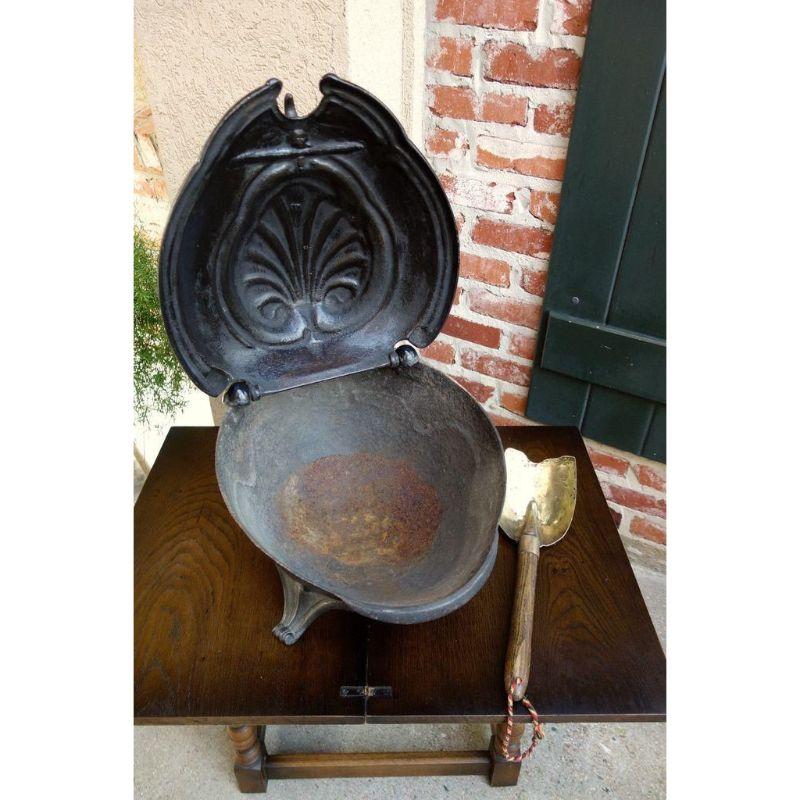 Direct from France, a heavy and substantial 19th century, French cast iron fireplace coal hod, in the shape commonly referred to as a “turtle” due to the shell shaped body and splayed legs. Unique and hard to find, perfect for a fireplace accent and