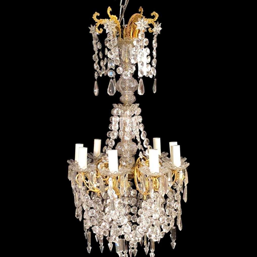 Transform any space into a mesmerising masterpiece with our Gorgeous French 19th Century 9 Arm Crystal Chandelier. This exquisite piece combines the timeless elegance of classical French design with a stunning array of beautifully hung crystals.