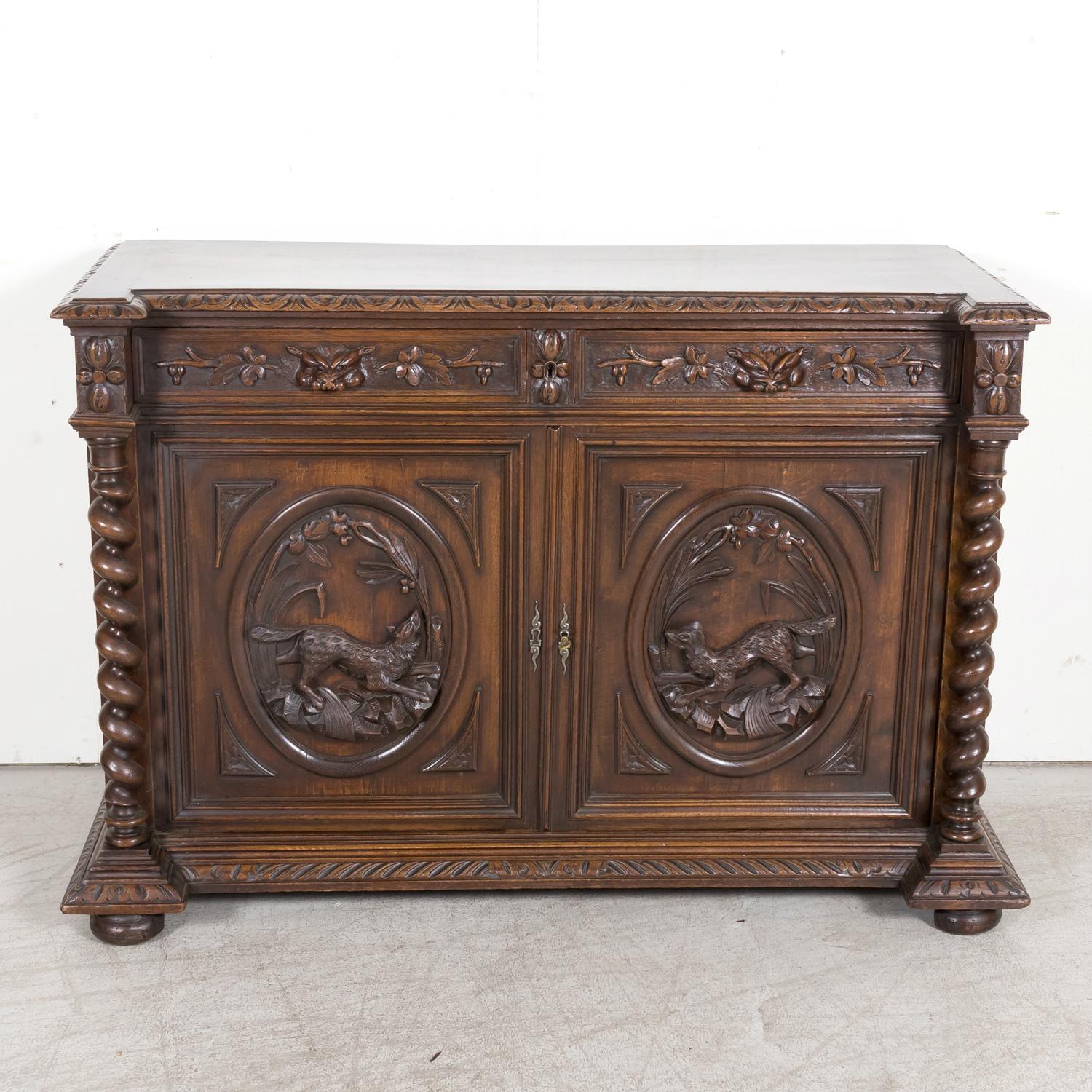 A very nice 19th century Louis XIII style buffet de chasse or hunt buffet handcrafted by talented artisans near Lyon of solid oak, circa 1880s. This handsome French Renaissance buffet features carved gadrooning on the top edge above two carved
