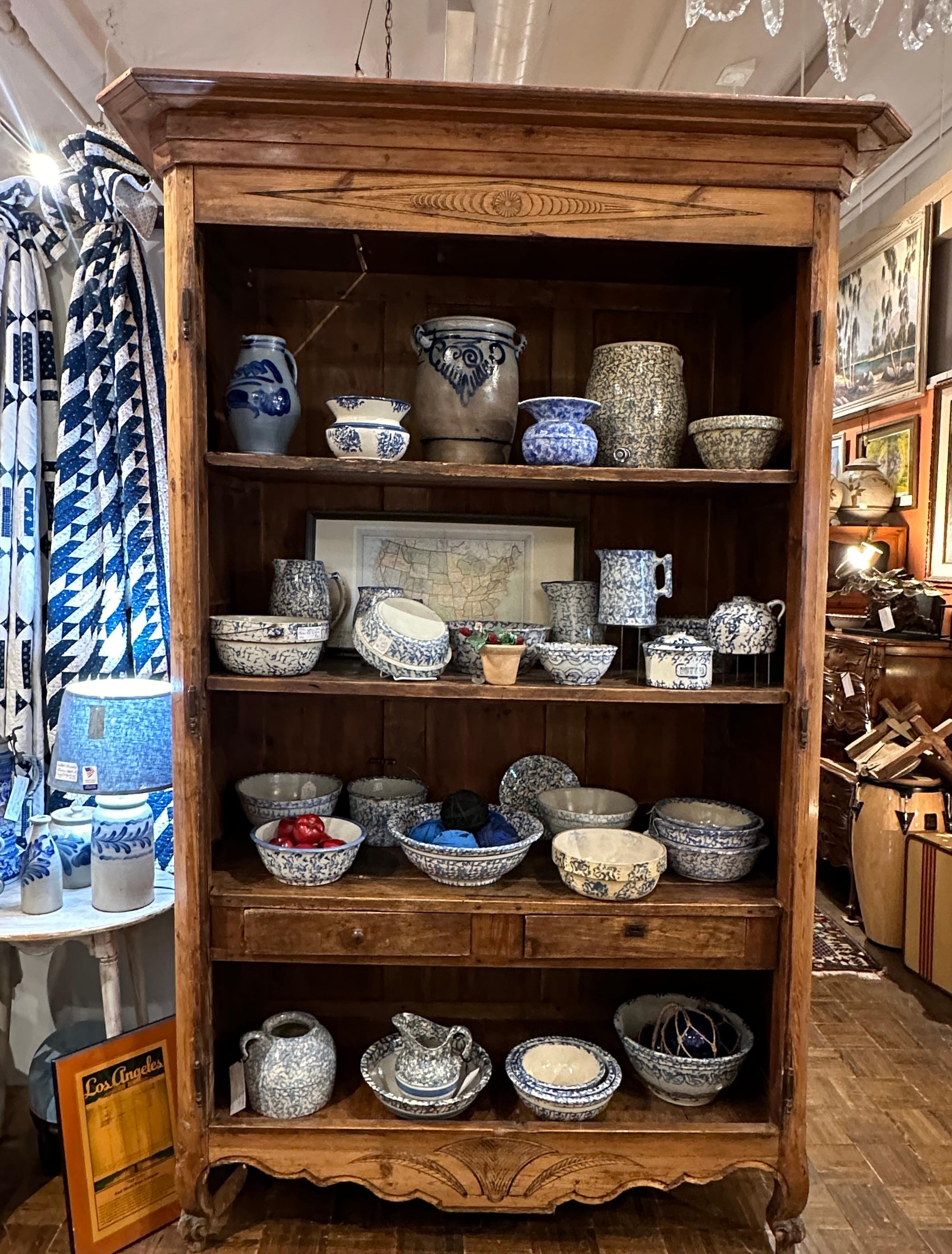 Antique French pine armoire.  Beautifully aged over the years..  iron hardware hinges and key escochons.  Interiors have shelving’s with two drawers for small items.  Exterior design is quite simple but beautiful!