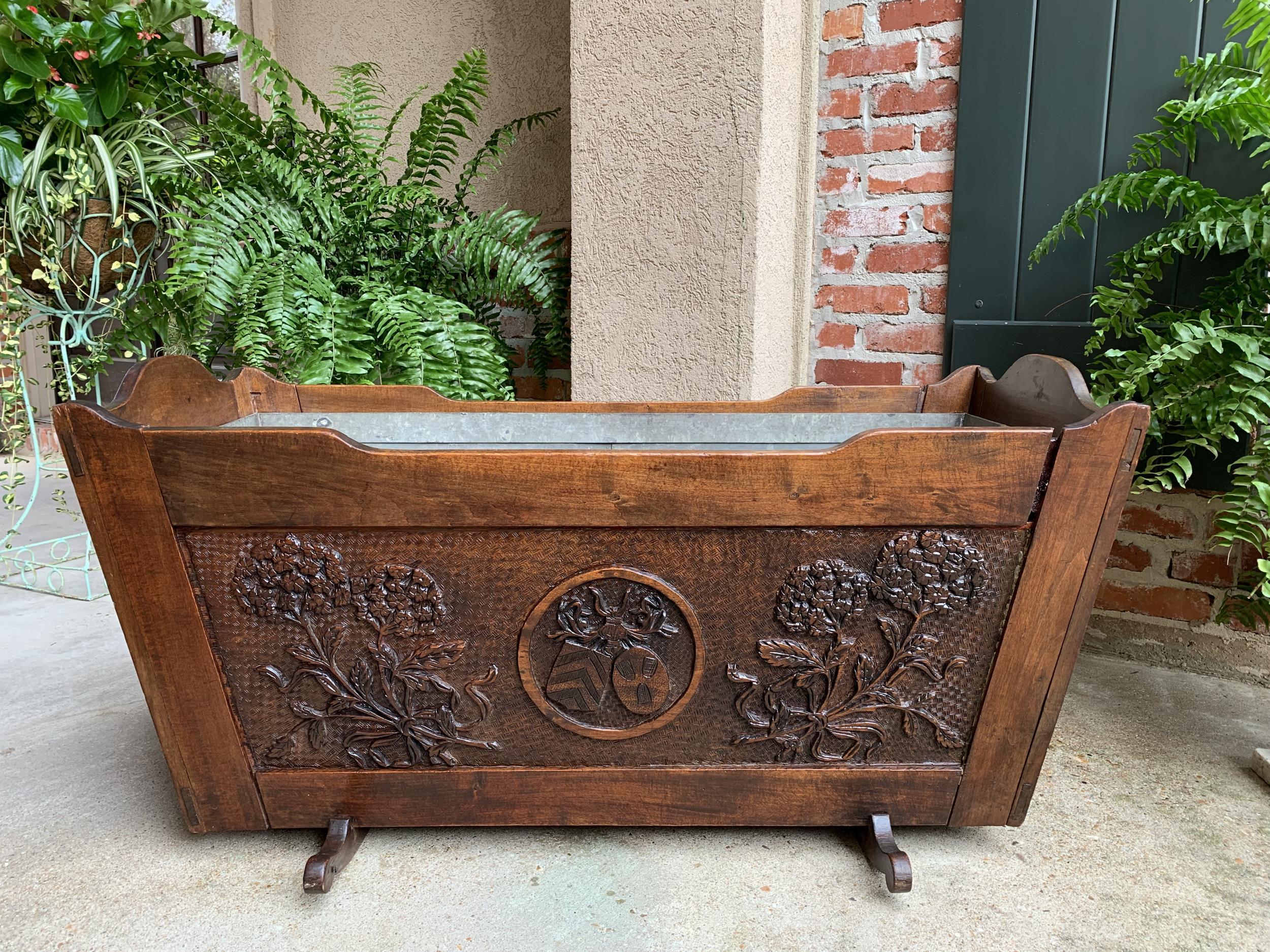 19th century French provincial carved oak baby doll crib planter drinks server.

~Direct from France~
~Lovingly carved family heirloom from the 1800s, this beautiful baby crib is carved on all sides, and has been modified for potential use as a