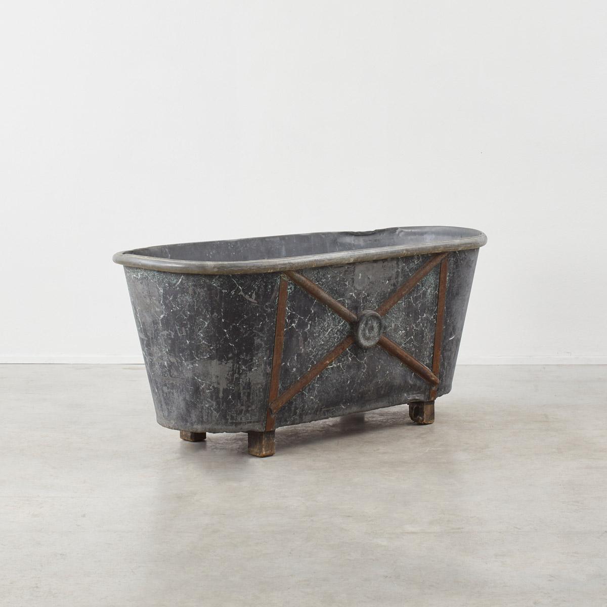 A rare 19th Century antique zinc double-ended roll-top bathtub by Chevalier Constructeur Paris, with decorative marbled exterior and striking cross motif. Military bathtubs like these were used by high-ranking officials on the battlefields during