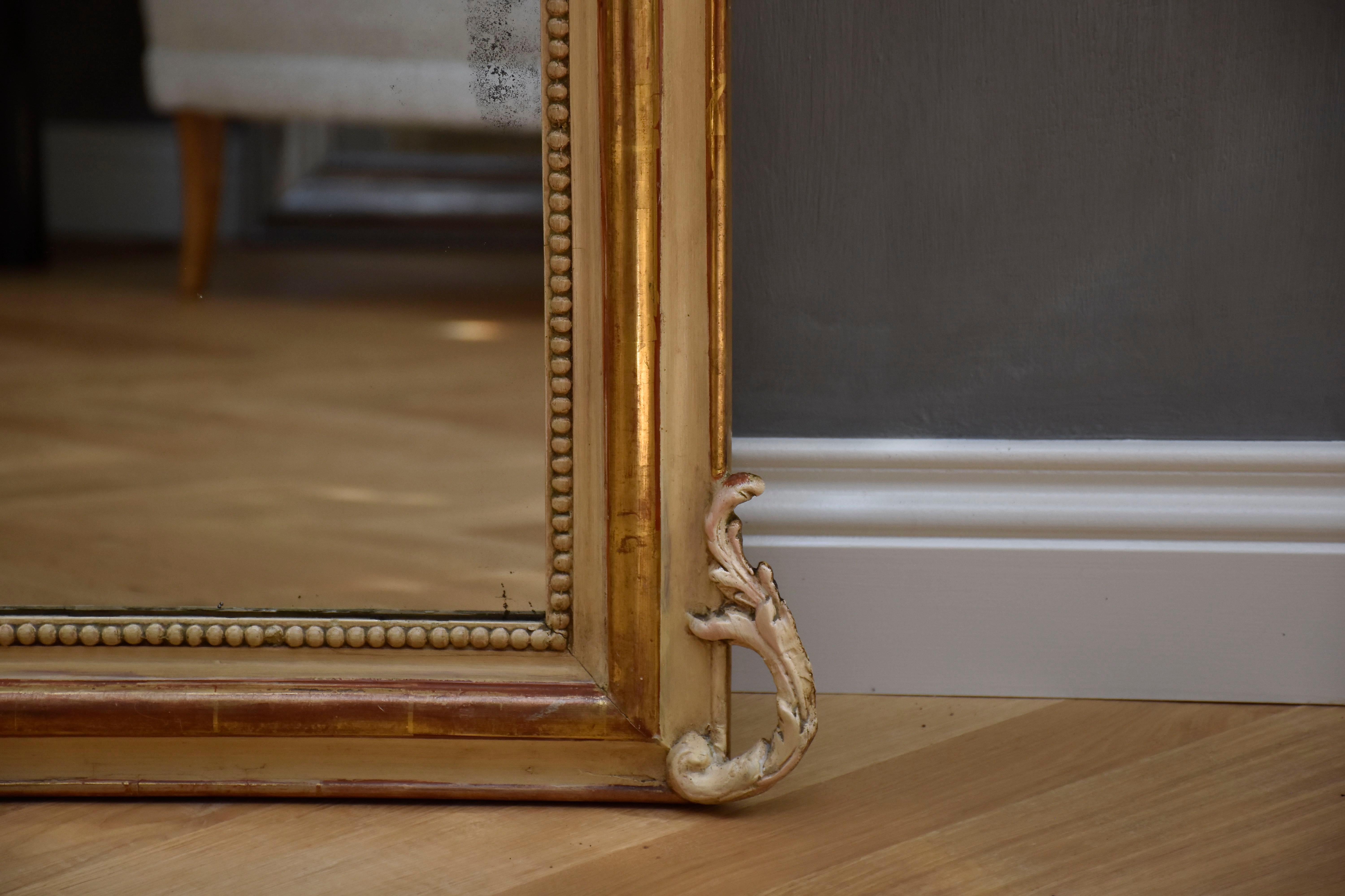 Gilt 19th century antique giltwood and carved French mirror Louis-Philippe For Sale