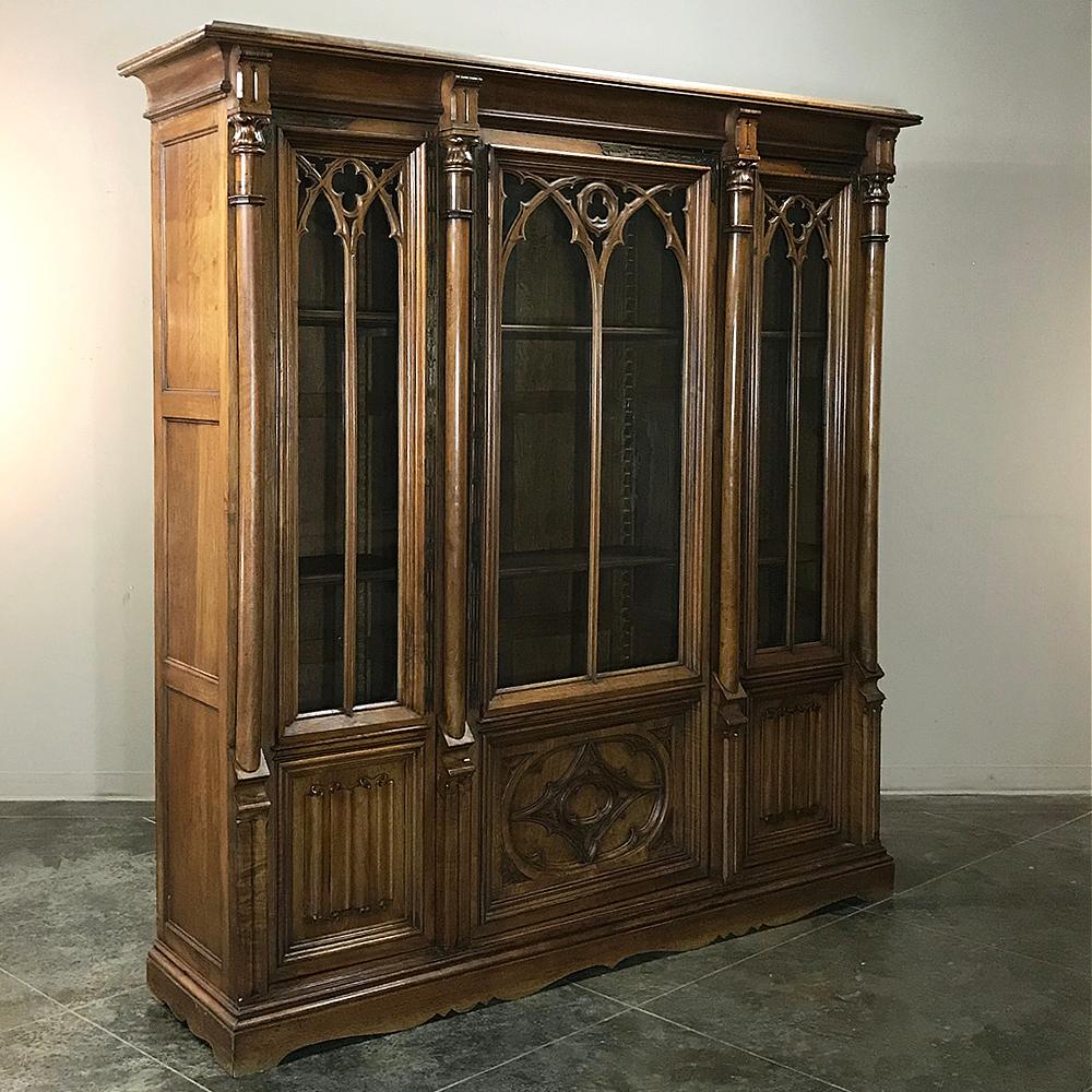 19th Century Gothic Walnut Triple Bookcase is a stunning example of French craftsmanship in what is considered the oldest formal style from Western Europe! Three compartments allow one to catalogue one's books, treasures, or what-nots, with arched