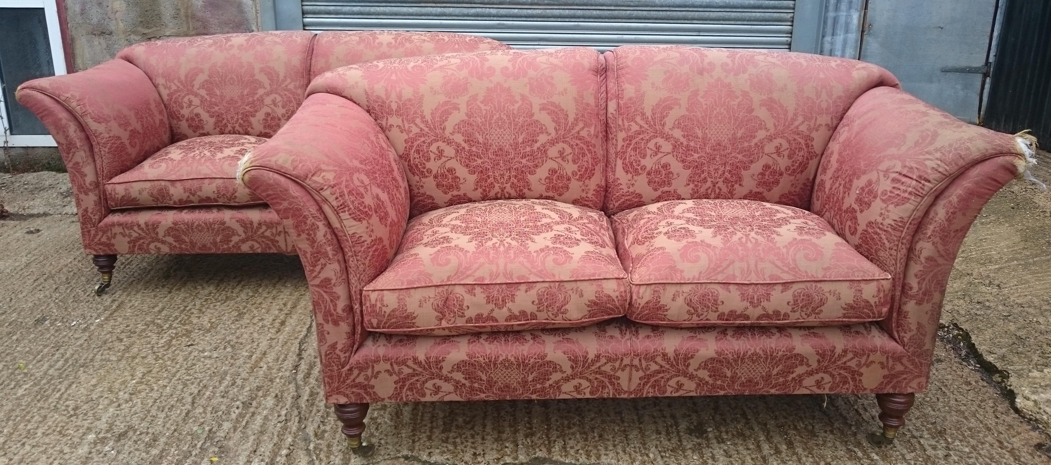 Antique Howard and Sons sofa, Grantley model. This sofa has high sides and back which is cosy in front of a fire. The high sides are sprung and have built in down cushions. This makes them supremely comfortable if sat on sideways with feet up. The