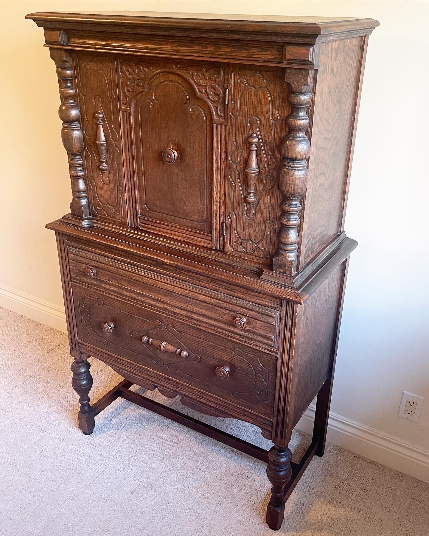 Incredible 19th century wooden cabinet. Features a hand carved design through the front face of the structure.
 