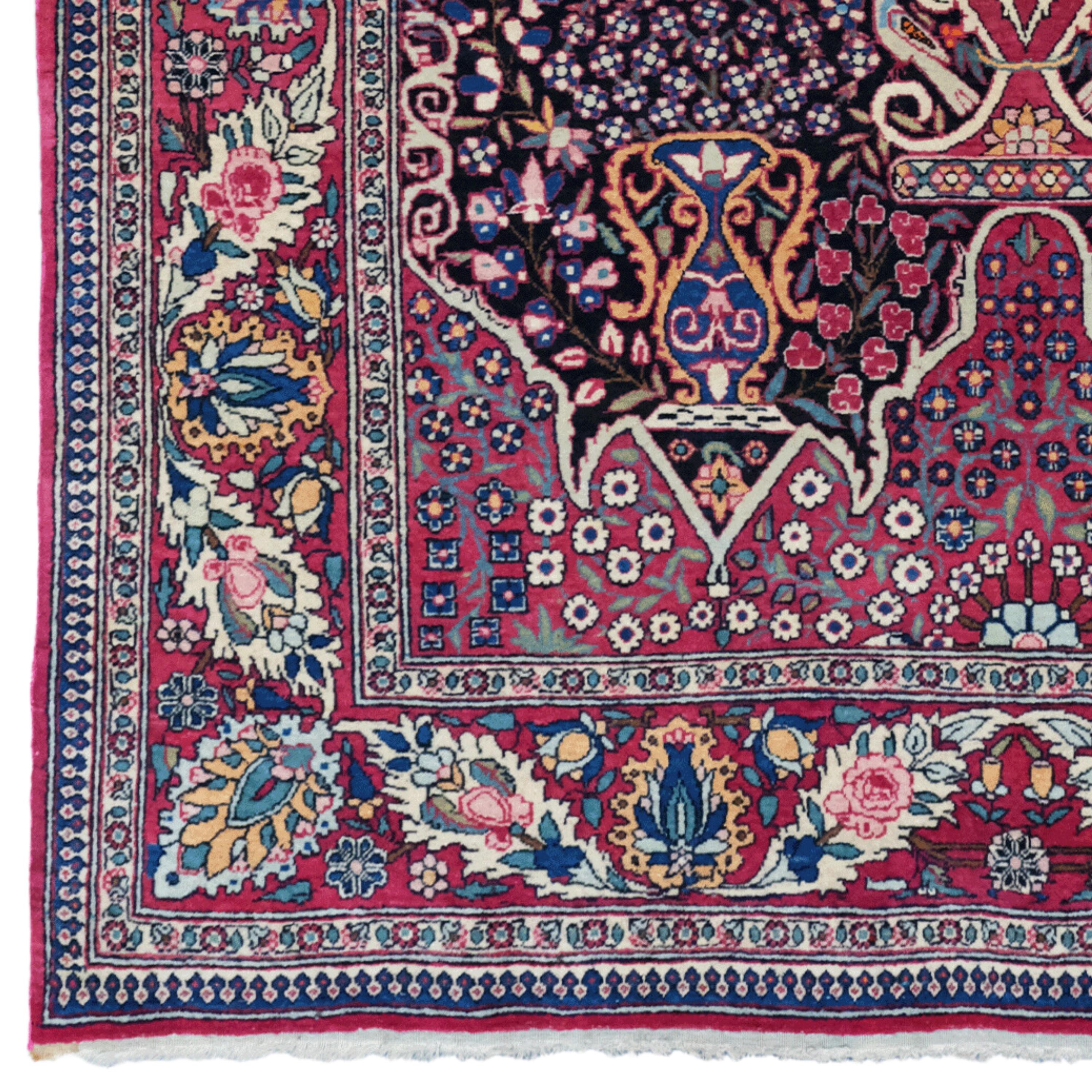 This late 19th-century antique Isfahan rug features deep red fielding and an intricate design adorned with vibrant colors.

Central Design: The deep red central area is decorated with floral motifs and ivy patterns.
Borders: The borders surrounding