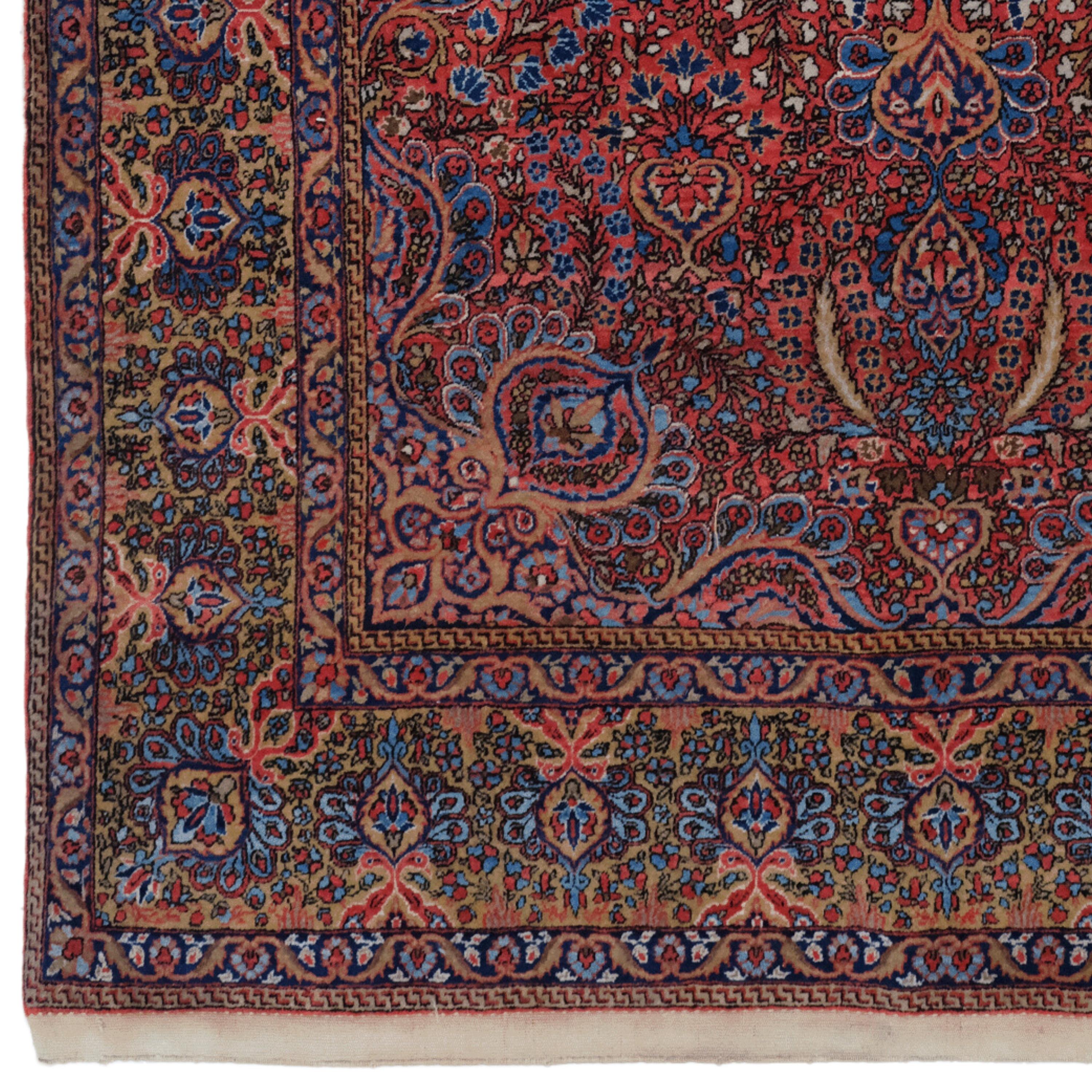 This late 19th-century antique Keshan rug is notable for its rich colors, intricate pattern and hand-woven craftsmanship.

Pattern and Colors: This rug is decorated with an intricate pattern in deep shades of red, blue, pink and cream.
Hand Weaving