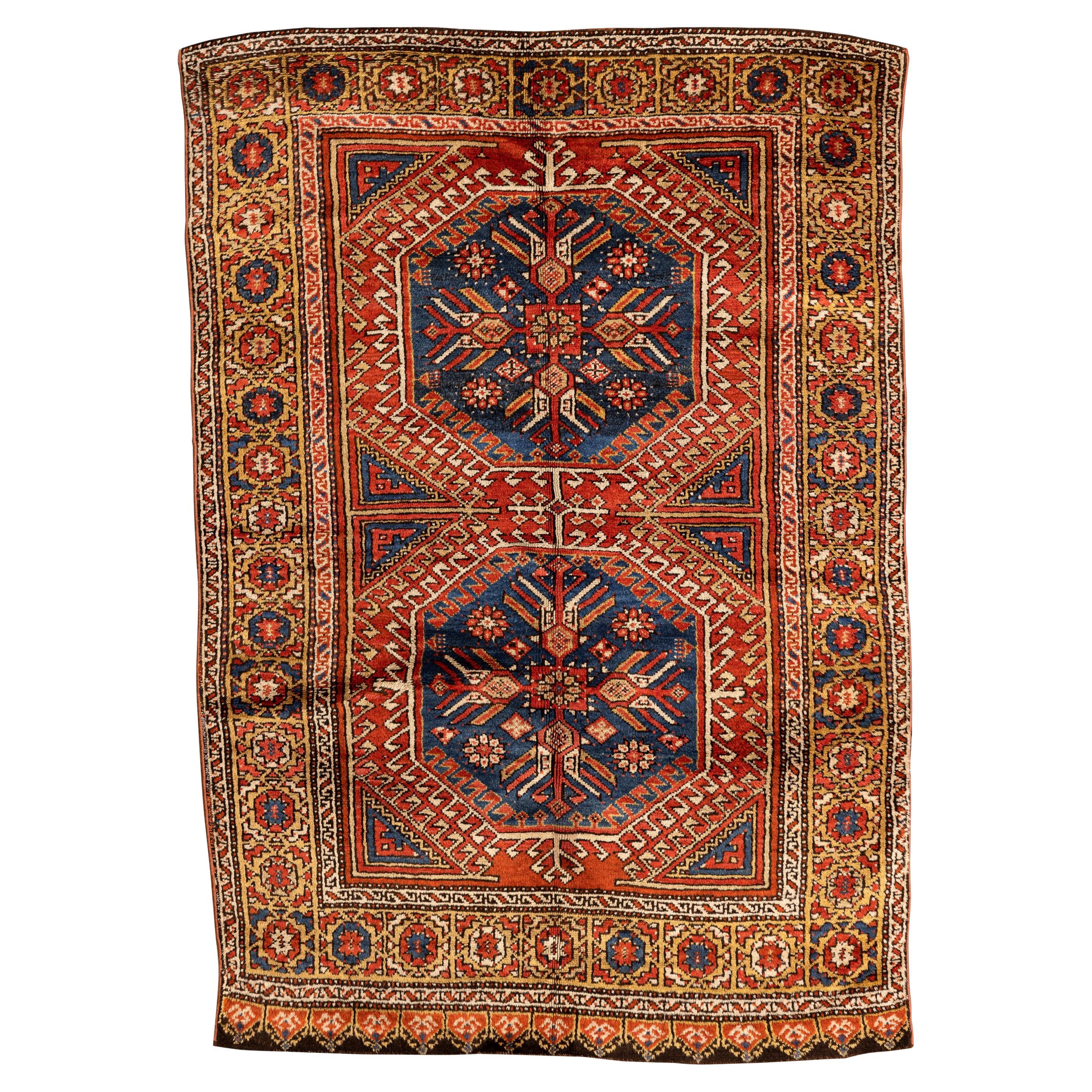 Konya – Central Anatolia

This Konya rug is one of the most famous and desired Turkish rugs for its magnificent colours, bright wool and bold nomadic design. With two geometric medallions, known as memling guls, in the centre, this rug has a