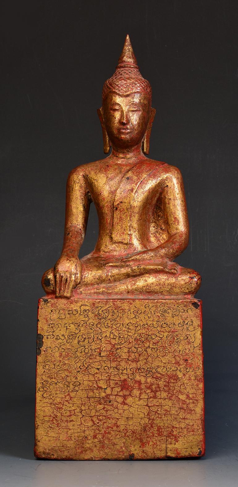 Lanna Thai wooden Buddha sitting in Mara Vijaya (calling the earth to witness) posture on a base.

Age: Thailand, 19th century
Size: Height 29.2 cm / Width 11.5 cm
Condition: Nice condition overall (some expected degradation due to its