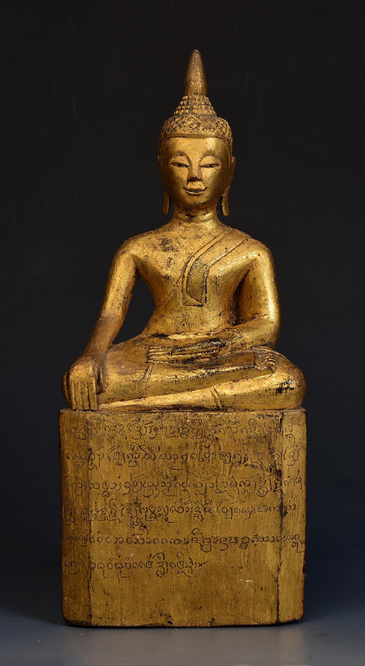 Antique Lanna Thai wooden Buddha sitting in Mara Vijaya (calling the earth to witness) posture on a base.

Age: Thailand, 19th Century
Size: Height 24.2 C.M. / Width 10 C.M. / Depth 6 C.M.
Condition: Nice condition overall (some expected degradation