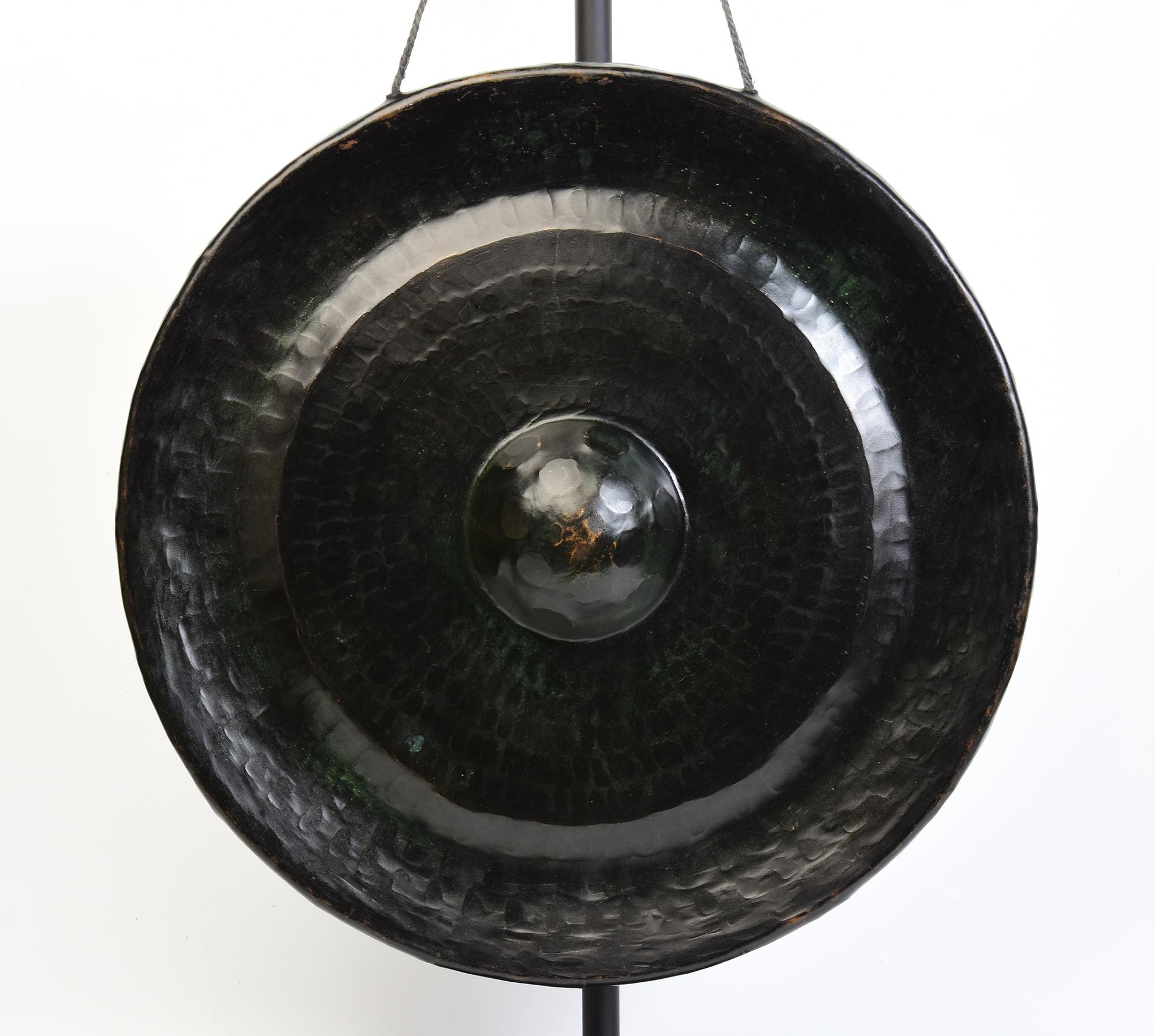 Antique Laos bronze gong, a kind of Laos musical instrument which produces a loud and sonorous sound. Gong stick is included.

Age: Laos, 19th Century
Size of gong only: Diameter 44.5 C.M. / Thickness 10 C.M.
Height including stand: 66.2