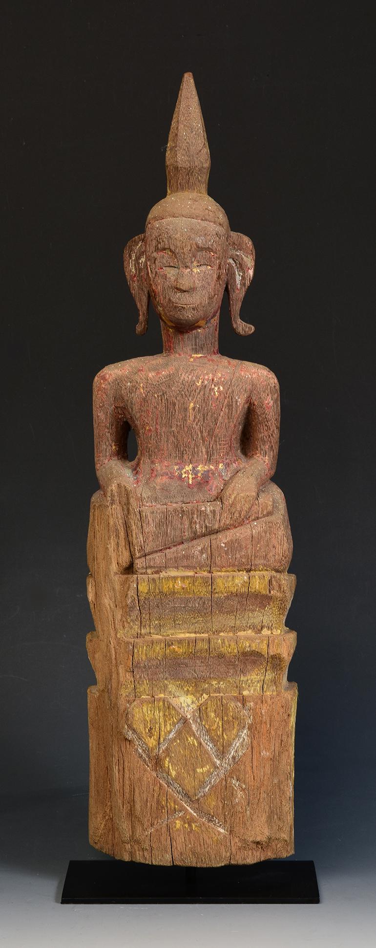 Laos wooden Buddha sitting on a base.

Age: Laos, 19th century
Size: Height 46.8 cm / width 12.5 cm.
Size including stand: Height 48.8 cm
Condition: Nice condition overall (some expected degradation due to its age).

100% satisfaction and