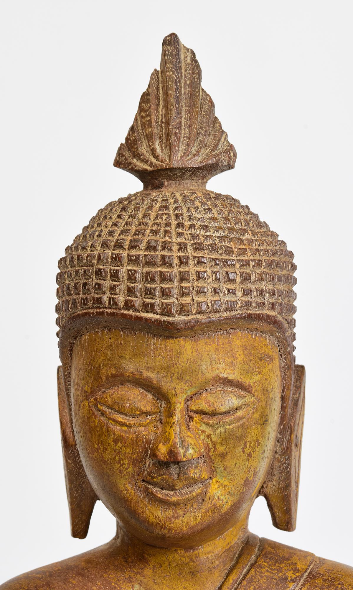 Antique Laos wooden Buddha sitting on a base.

Age: Burma, 19th Century
Size of Buddha only: Height 36 C.M. / Width 21.1 C.M. / Depth 9.8 C.M.
Height including stand: 39.7 C.M.
Condition: Nice condition overall (some expected degradation due to its