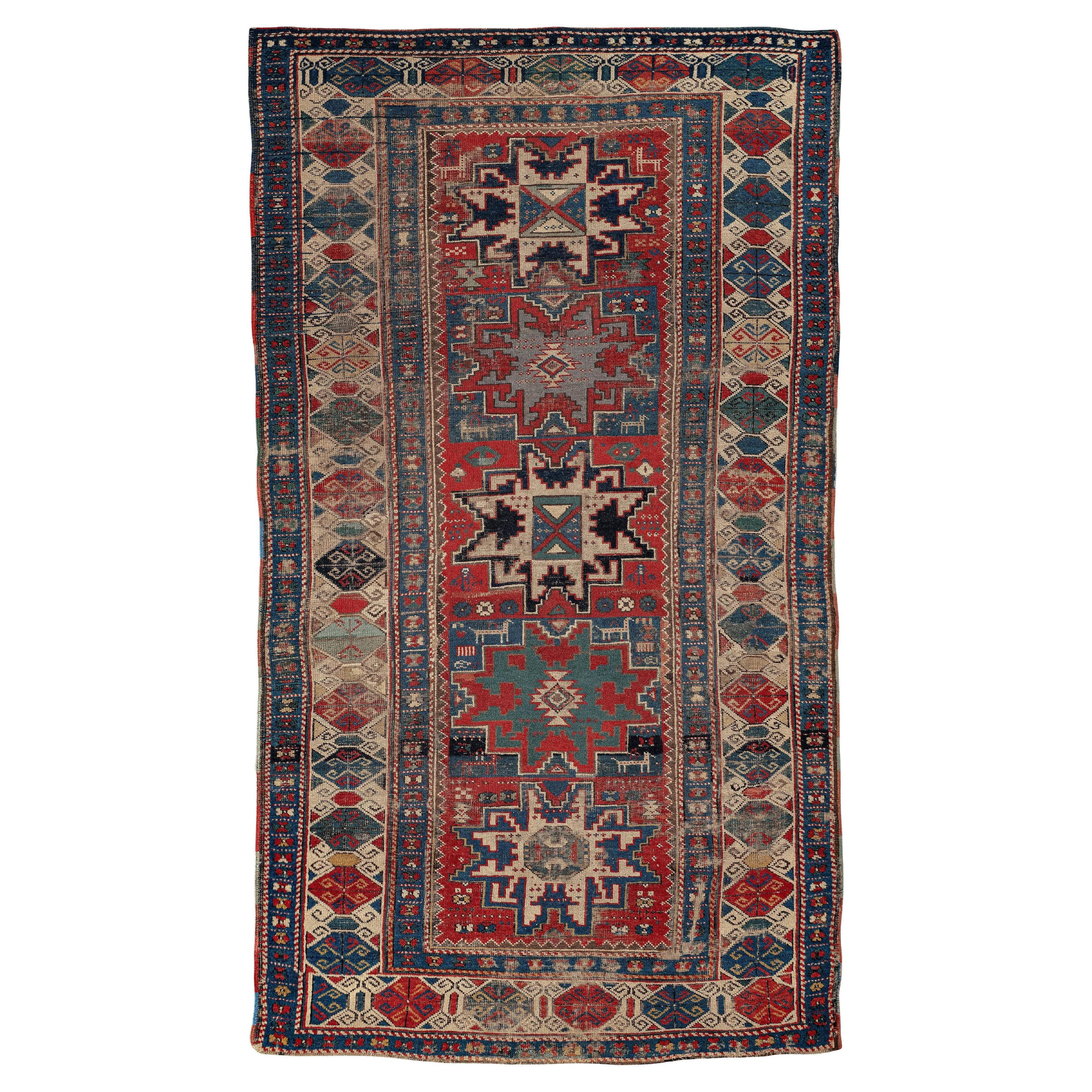 Lesghi – Dagestan, Northeast Caucasus

This vibrant rug features the familiar lesghi stars – the geometric figure identifying this Caucasian group. In an extensive field of red jasper, five star-shaped figures float amidst a cosmos of geometric