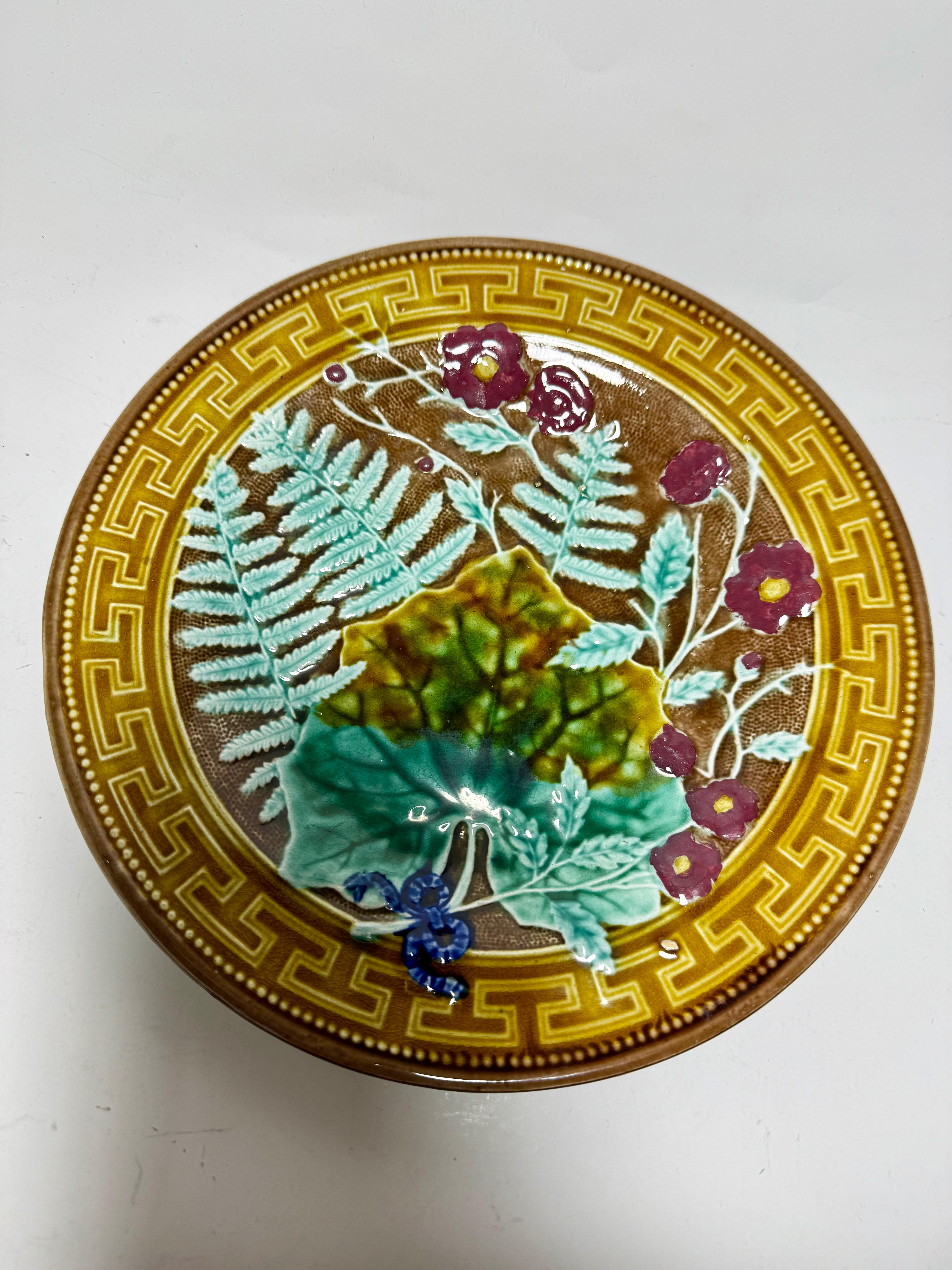 Art Nouveau Majolica 
Rare exemplar of antique majolica Gustavsberg Sweden
1860-1890 according mark
A fantastic antique majolica plate, d 21,0 cm ( 8,27 inches)
A beautiful rich floral design with high gloss glazed finish. 

In very good condition