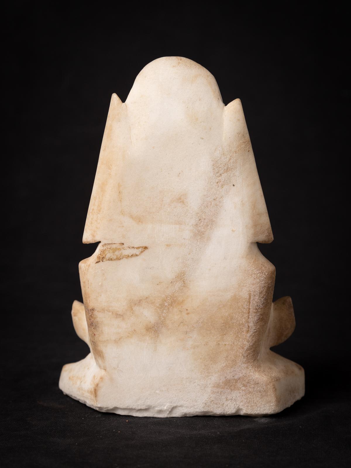 Material : marble
17,8 cm high
13 cm wide and 5,5 cm deep
With traces of 24 krt. gilding
Shan (Tai Yai) style
Bhumisparsha mudra
19th century
Burmese name : Shin Upago, he is a popular saint
Weight: 1,22 kgs
Originating from Burma
Nr: 3672-18
