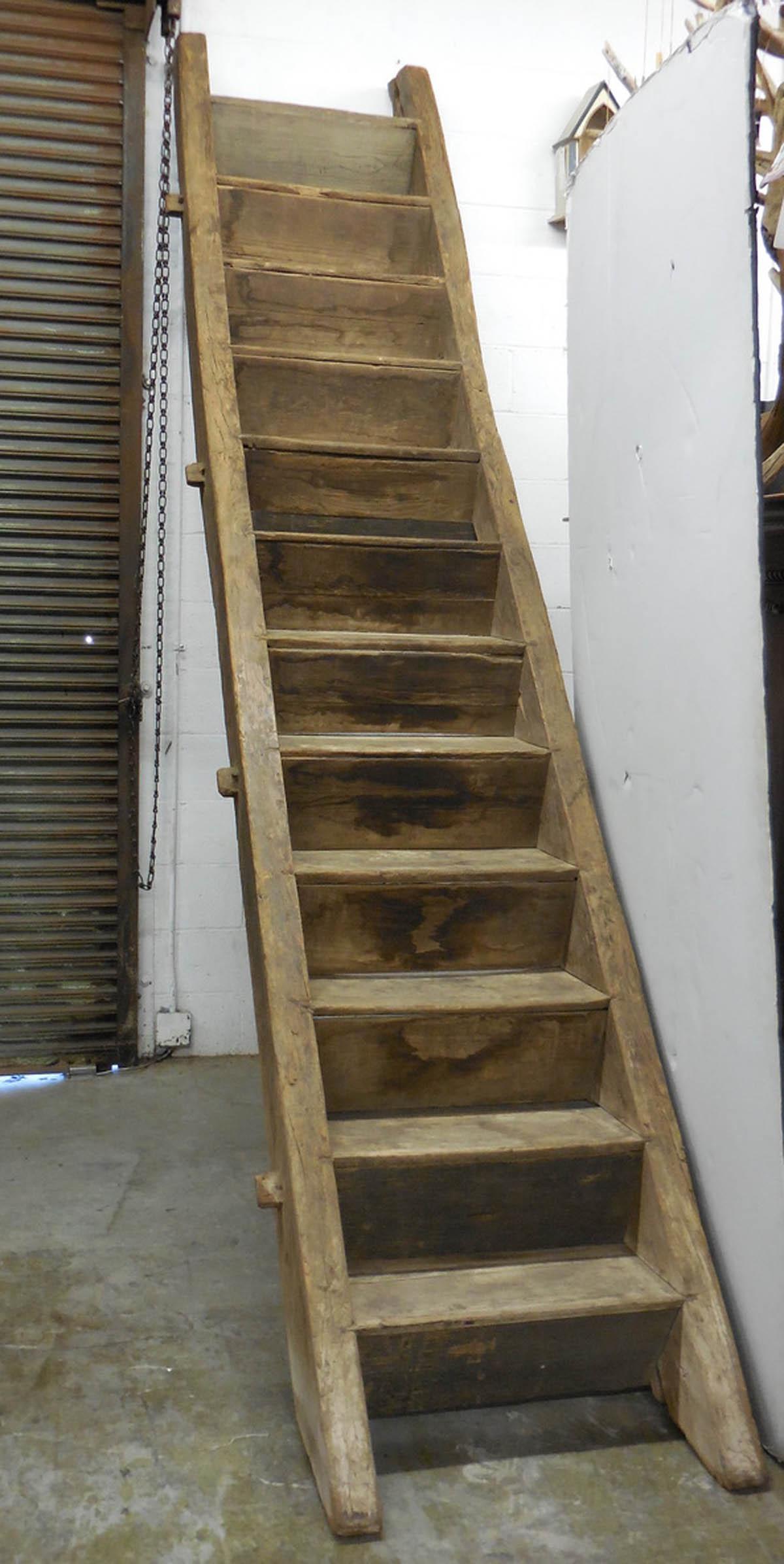 Old elmwood stairs made in mortise and tenon construction. Very sturdy. When standing up as it would if installed, it measures 119 inches tall. Each step/tread measures 9 inches deep and the rise is 9.5 inches tall. The width of the stair is