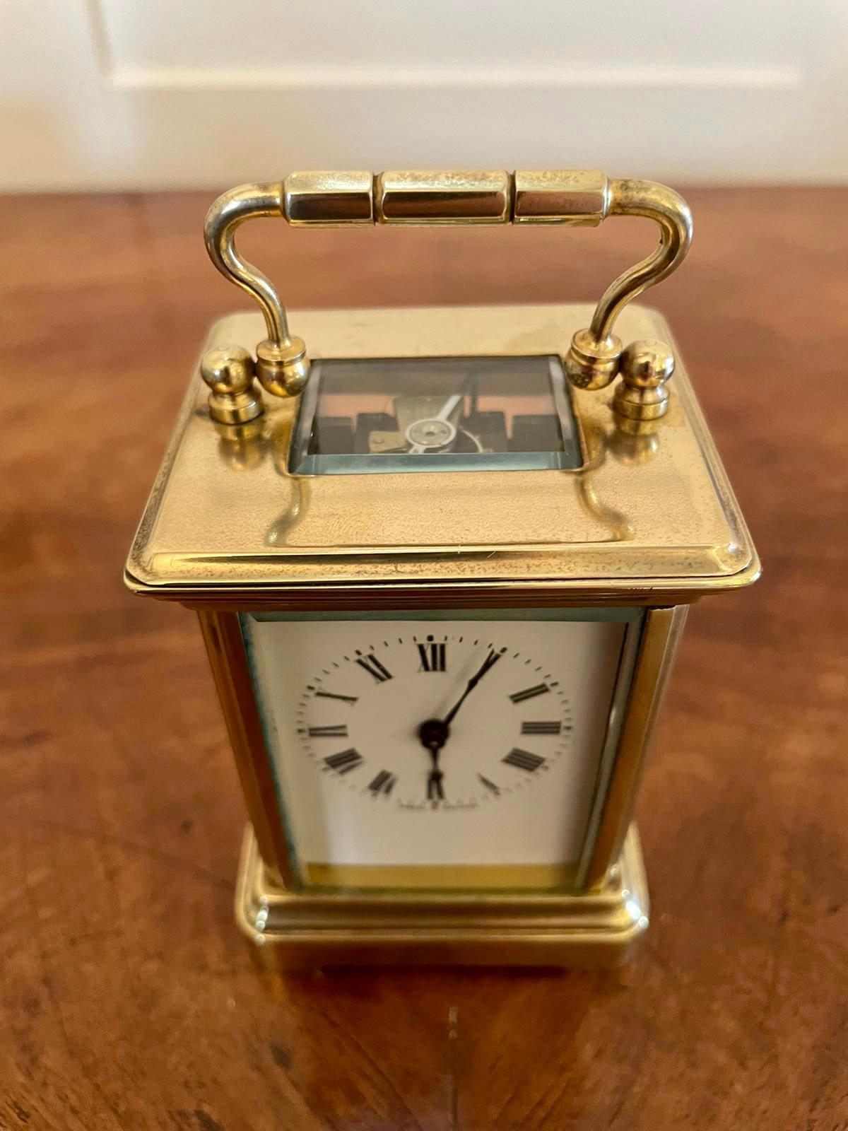 19th century antique miniature brass eight day carriage clock having a quality brass case, eight day french movement, enamelled dial with elegant original hands and bevel edged glass. It is in good working order and comes in its own original