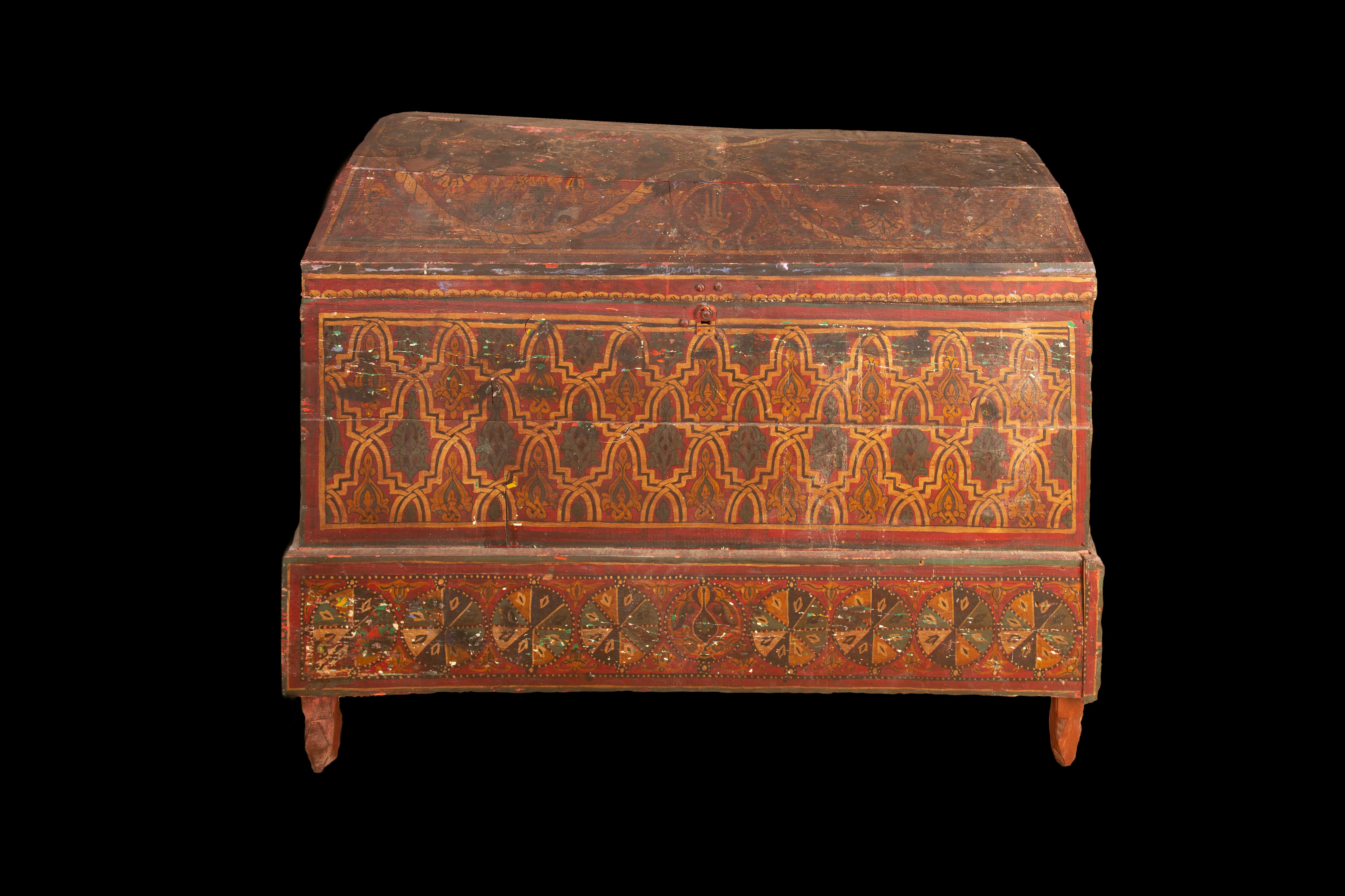 This 19th century Moroccan Berber chest is a masterpiece of craftsmanship. Made from pine wood, it features beautifully painted sides and top, showcasing intricate patterns and vibrant colors. The original interior offers ample storage space for
