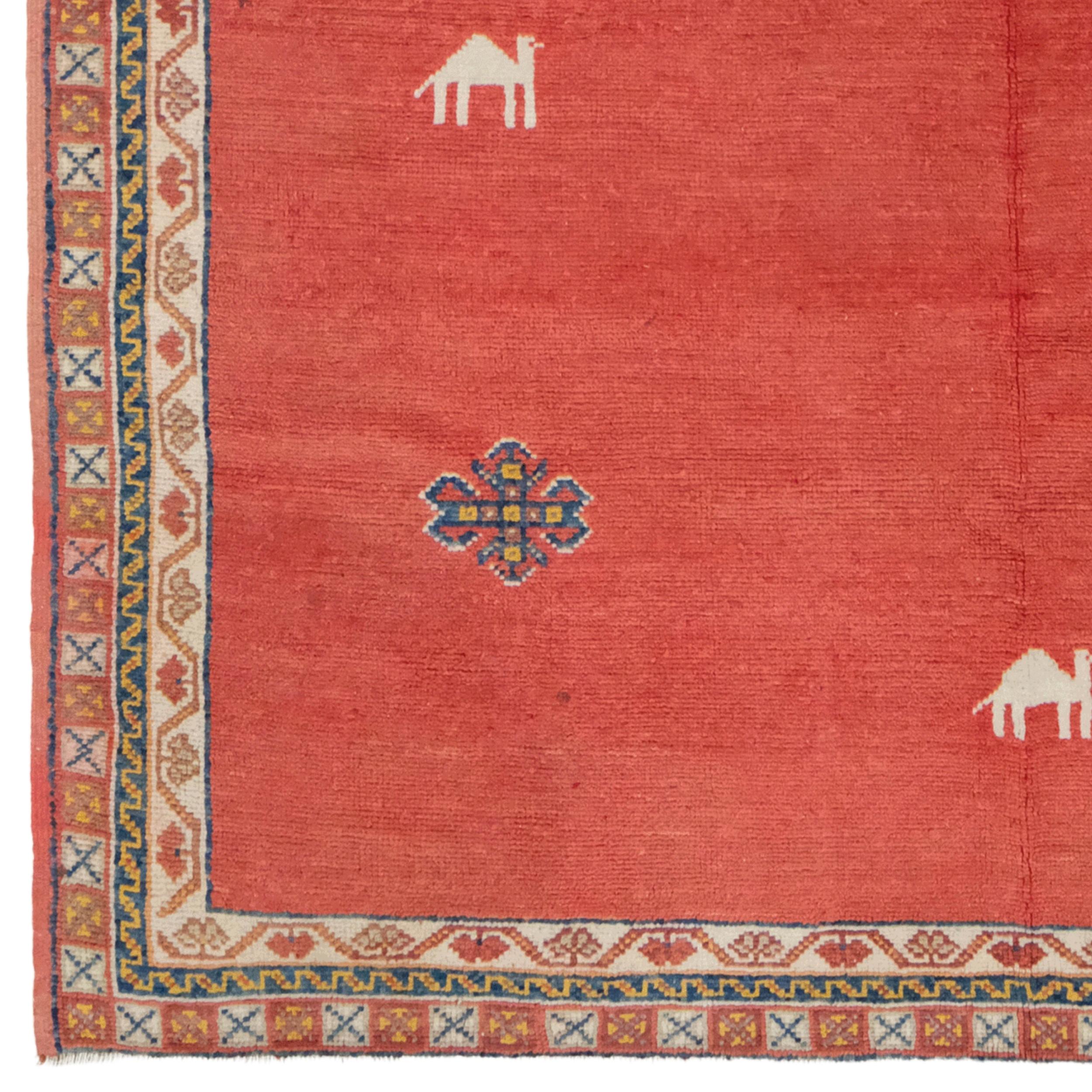 This unique 19th century Moroccan carpet in your hands is of great value both historically and aesthetically. The carpet's rich patterns and motifs placed on a red background are one of the best examples of Morocco's artistic and cultural