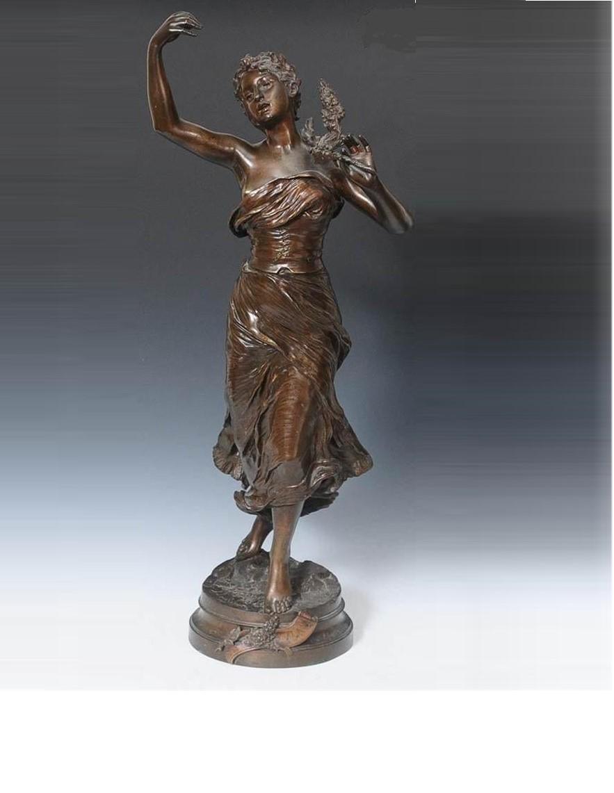 The Following Item is An Outstanding 19th Century Bronze sculpture showcasing a Standing female showcasing a Beautiful Bronze Woman with one arm raised and one the other hand holding garland. Taken out of a Prominent New England Estate.