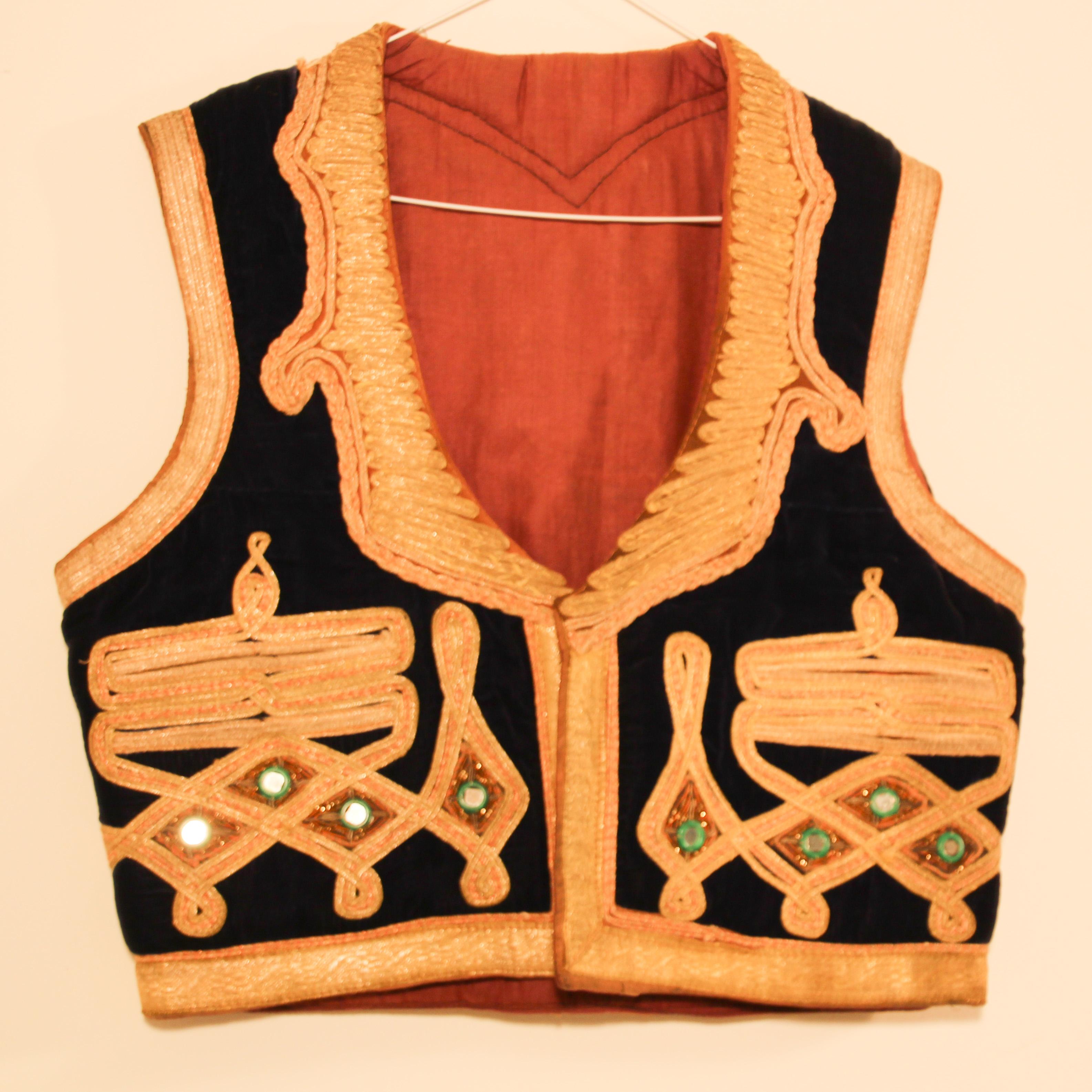 Authentic late 19th century antique ottoman Turkish vest in royal blue silk velvet decorated with elaborate gold thread, trimmed with gold metallic thread.
Elegant vest handmade embroidery with small mirrors inset on blue silk velvet, fully