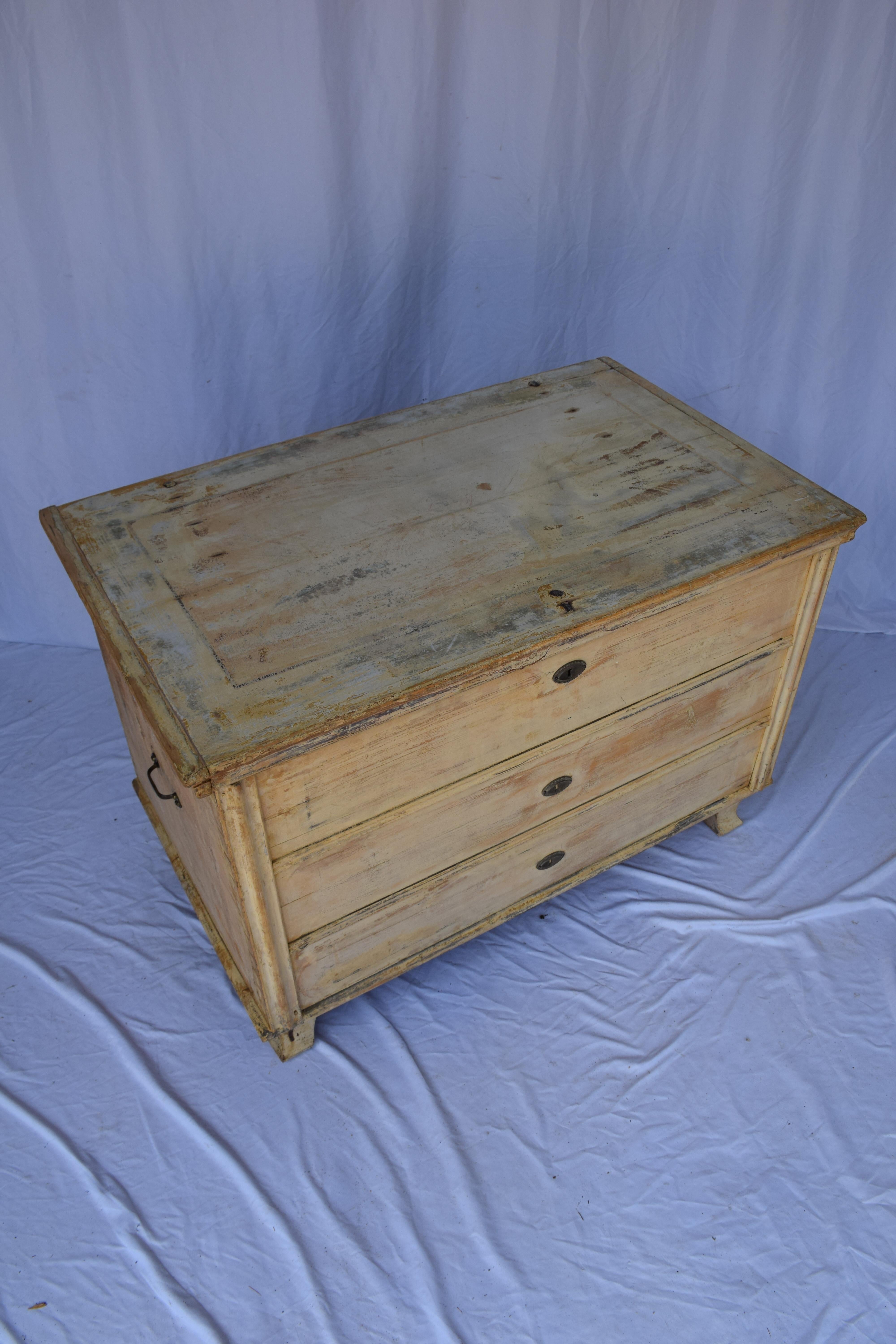 19th Century antique painted flat top trunk. The wrought iron handles on each side make it easy to carry and move about. The flat top makes this trunk ideal to serve as a small coffee or side table table as well. Any nicks, scratches, worn areas of
