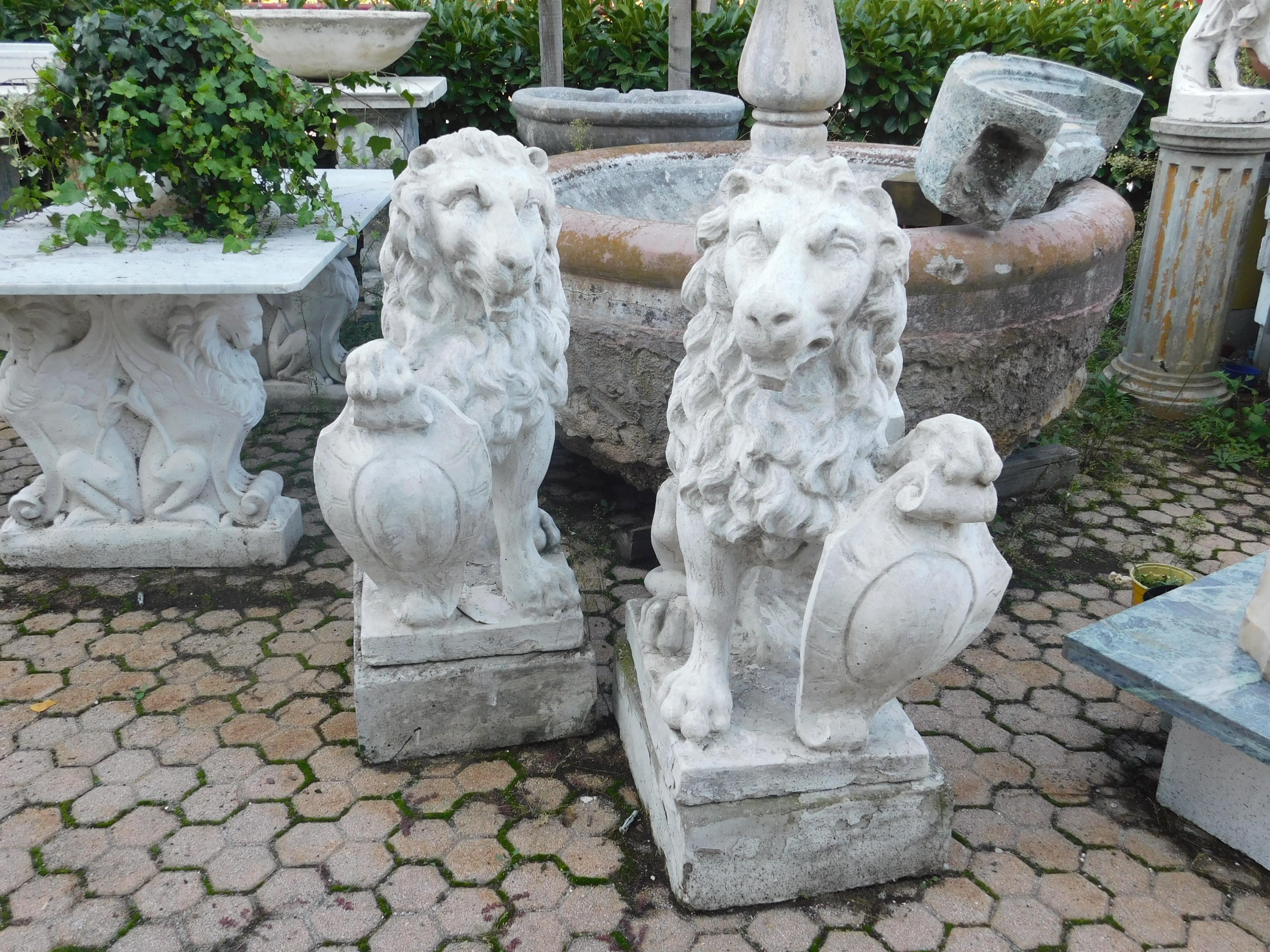 19th century antique pair of artificial stone lions, for entrances or like garden statues with customizable crest.