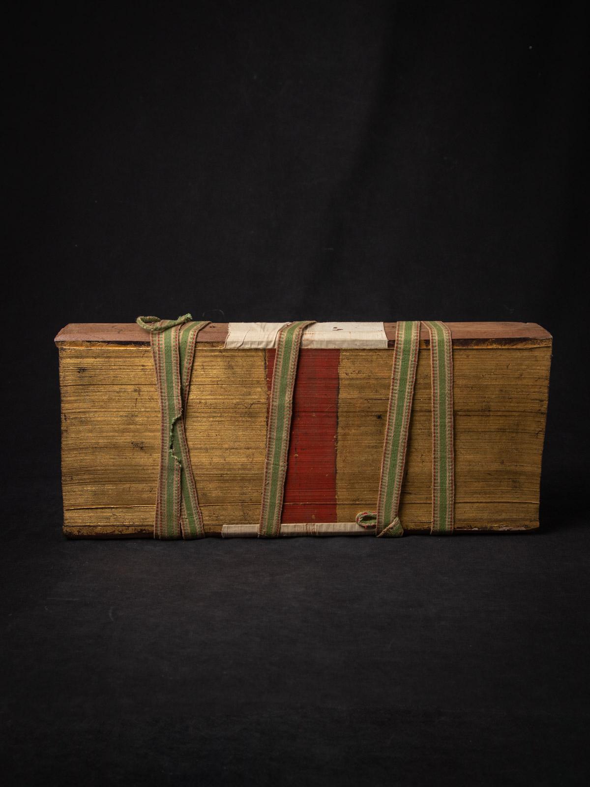 The Antique Palm Leave Manuscript book is a remarkable significant artifact originating from Burma. Crafted from Palm leaves & wood, it stands at 21,5 cm in height and measures 49,1 cm in width and 7 cm in depth. 

Created in the 19th century, Was