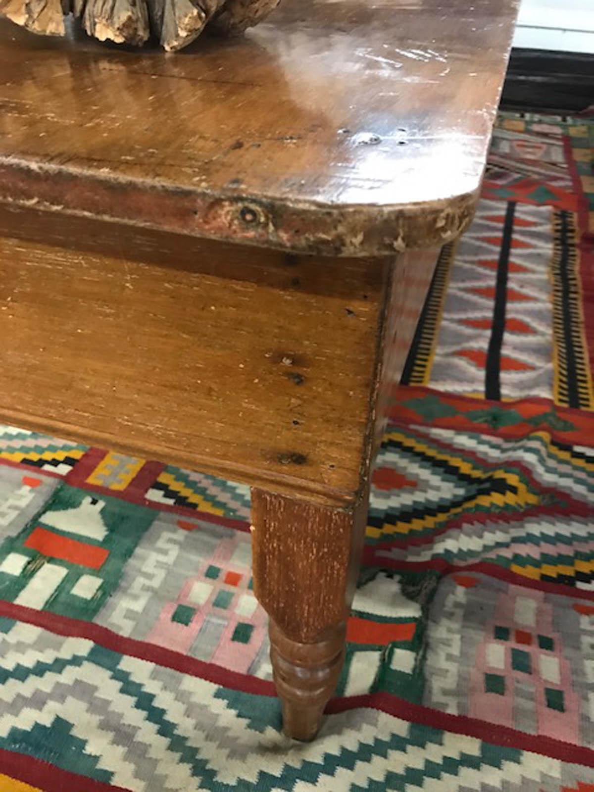 19th century cedro, tropical hardwood, low table (coffee table) with turned legs and one drawer. Top has two wide planks. Beautiful patina, very small traces of old paint.
