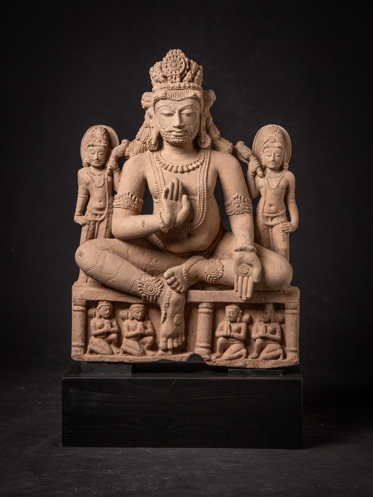 This sandstone sculpture, originating from Madhya Pradesh in India during the 19th century, is a striking piece of art. Carved from sandstone, it stands at an impressive height of 69 cm and features dimensions of 41.5 cm in width and 16.5 cm in