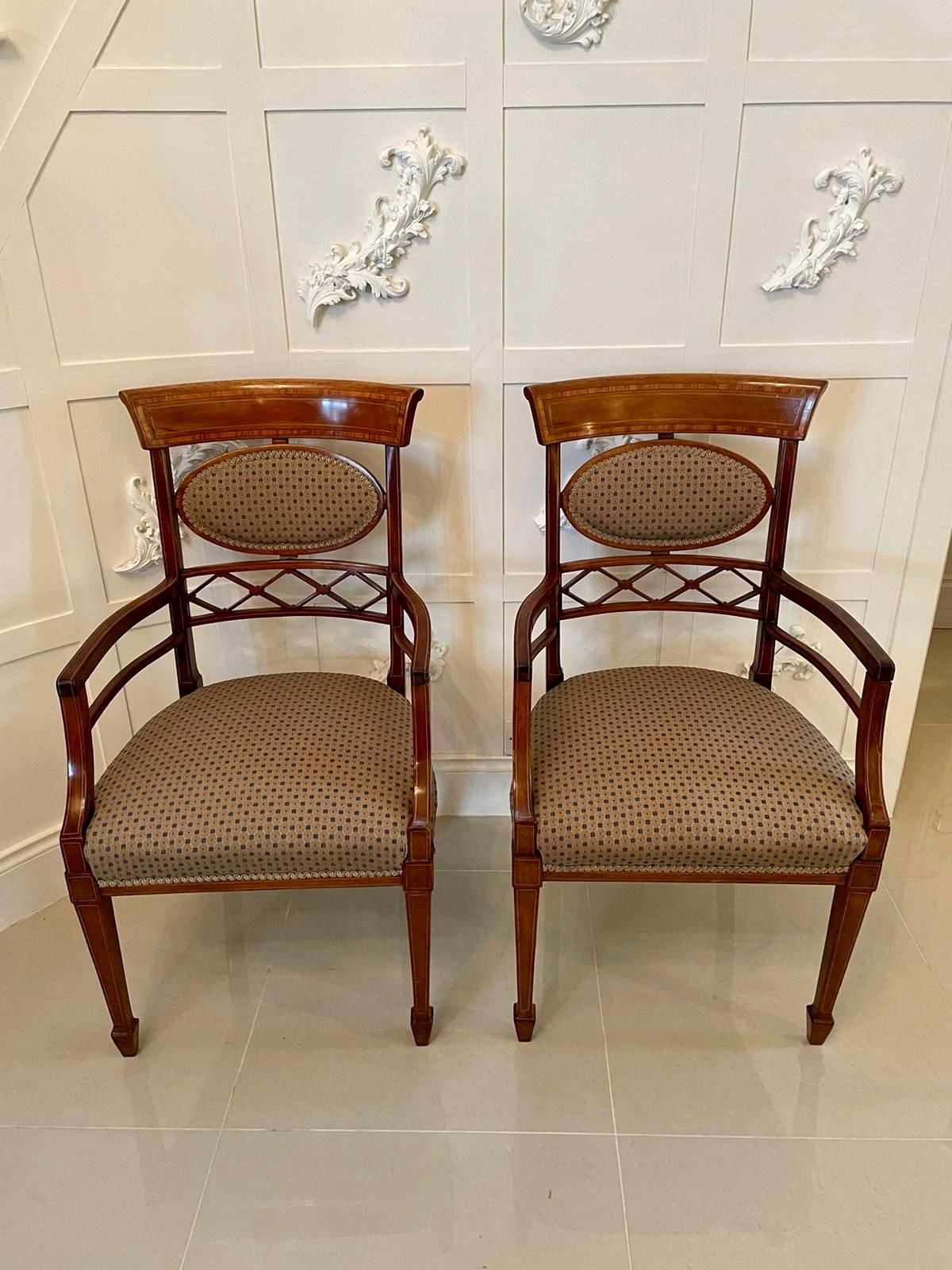 Fine quality elegant 19th century set of eight antique mahogany inlaid dining chairs consisting of two carver chairs having elegant shaped open arms and six single chairs having attractive shaped inlaid mahogany top rails and unusual but pleasing
