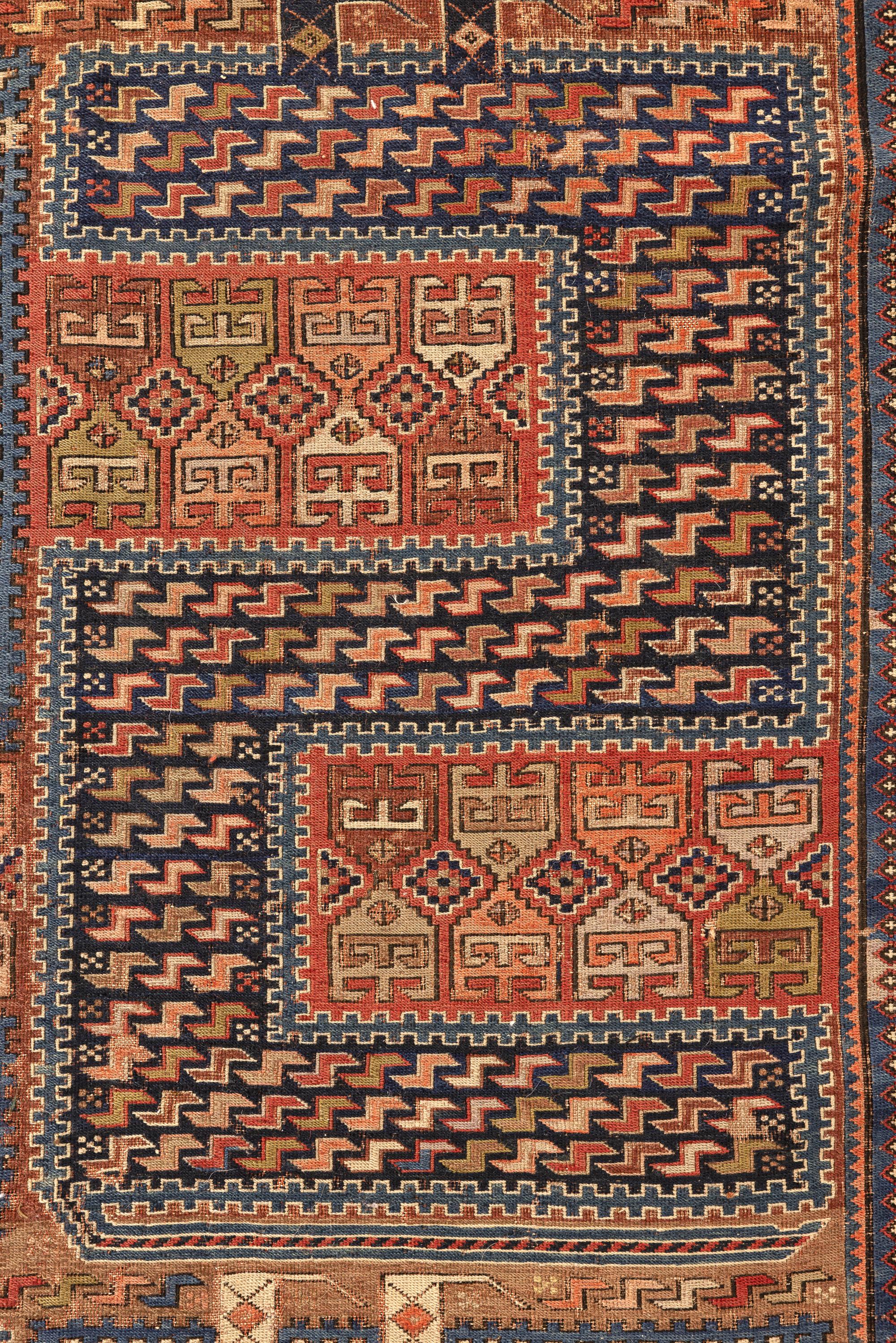 Sileh – Karabagh, South Caucasus

This splendid Sileh is of outstanding artistry and was woven with the best quality of the Soumaks. It is filled with tribal and animal motifs around four alternating columns in the shape of an S in reverse, in ivory
