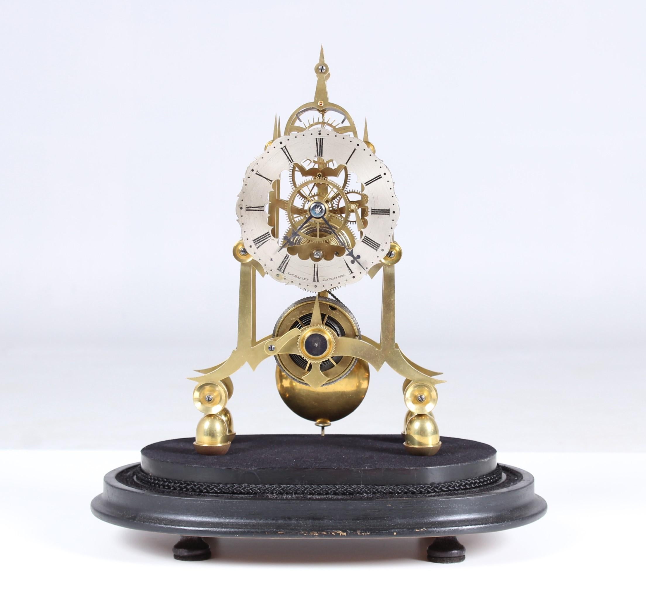 Antique skeleton clock

England
Brass, wood, glass,
Middle 19th century

Dimensions: height with glass dome ca 30 cm

Description:
Ebonized wooden base mounted clock with eight-day movement with anchor escapement.
Winding by drum, fusee