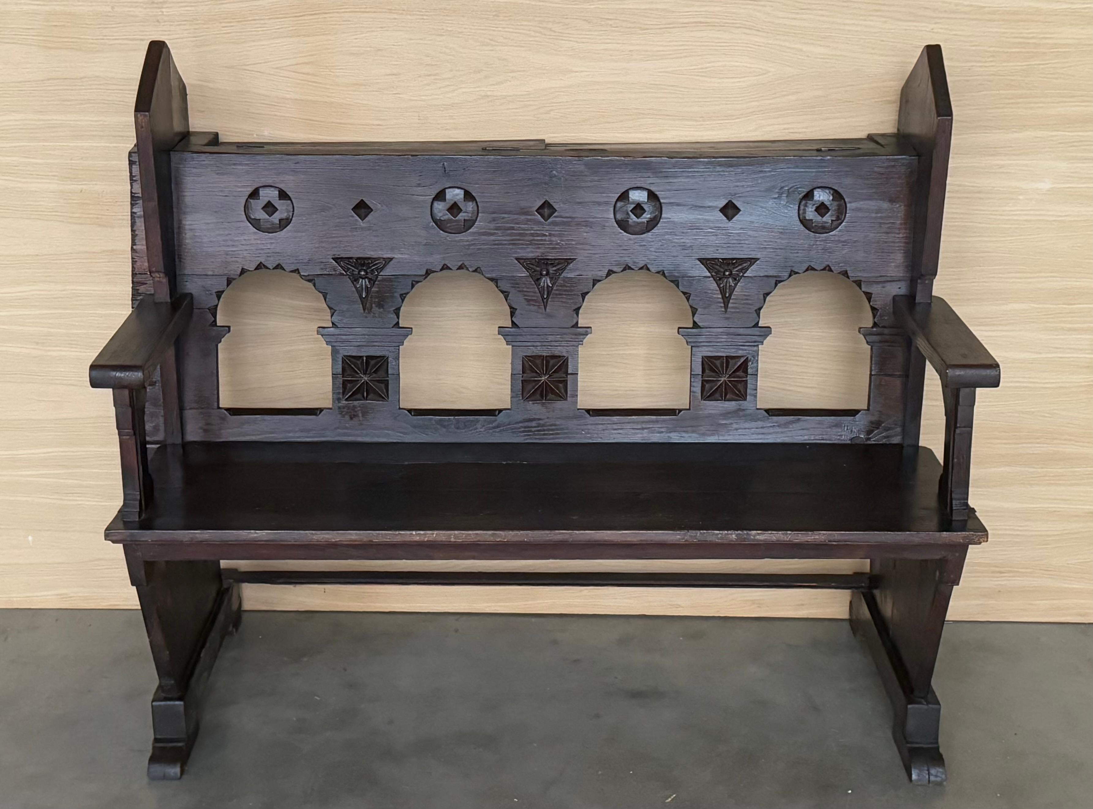 This wonderful antique freestanding oak church pew in gothic style from the late 19th century is a fantastic addition for enthusiasts. It is beautifully carved and has a storage in the back you can see in the pictures.  Due to its considerable age,