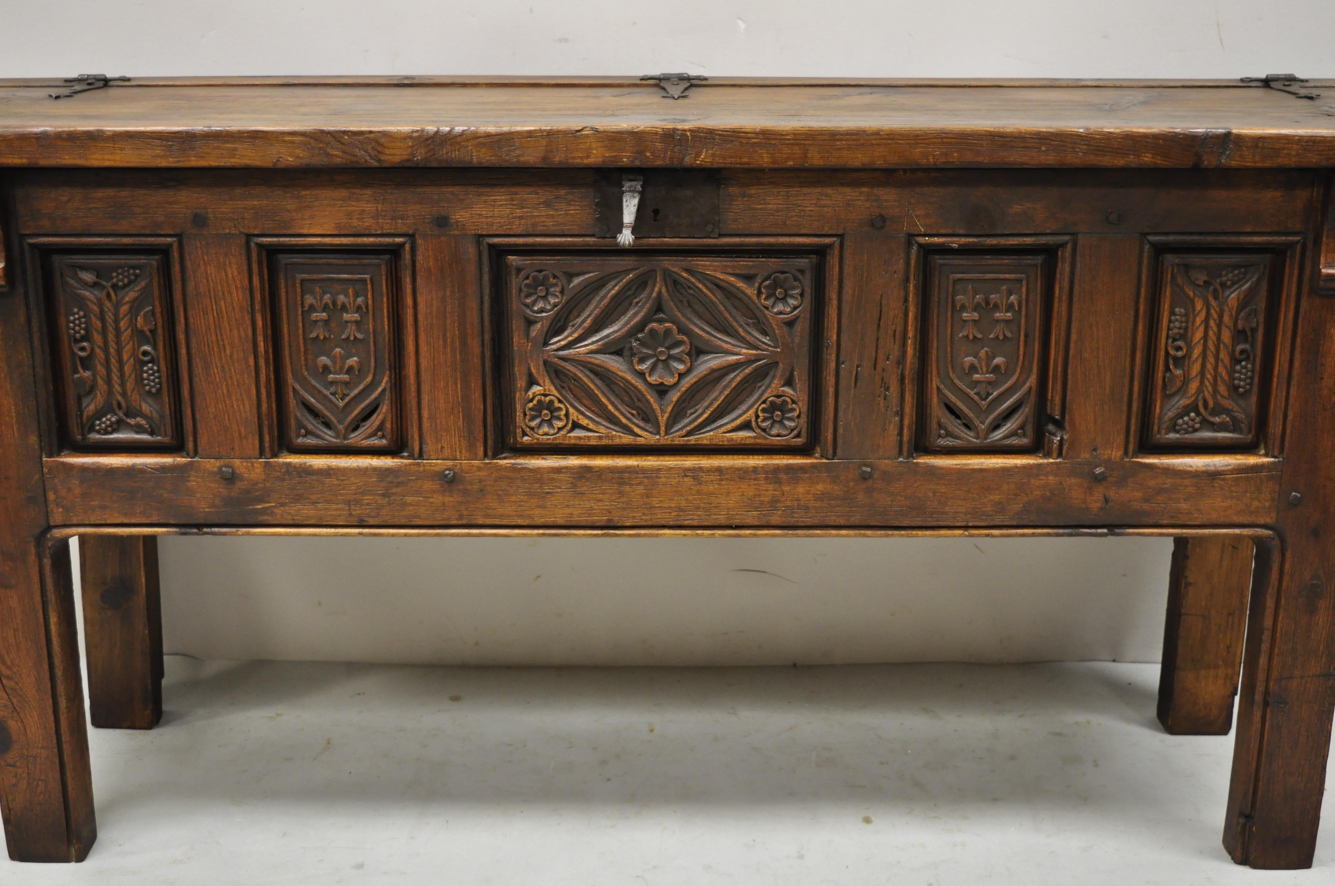 19th century antique Spanish Jacobean oak walnut coffer trunk chest on legs. Item features original authentic patina, cast iron hardware, lift lid, up on legs, solid wood construction, beautiful wood grain, nicely carved details, very nice antique