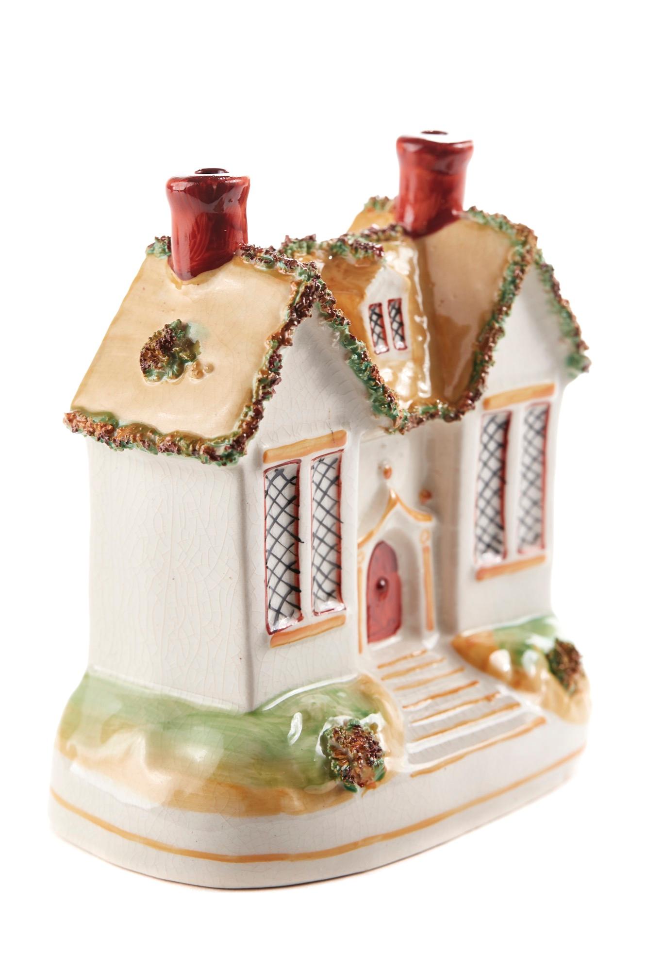 This is an unusual 19th century antique Staffordshire Cottage. This is a pretty colorful cottage. It is in perfect condition.


  