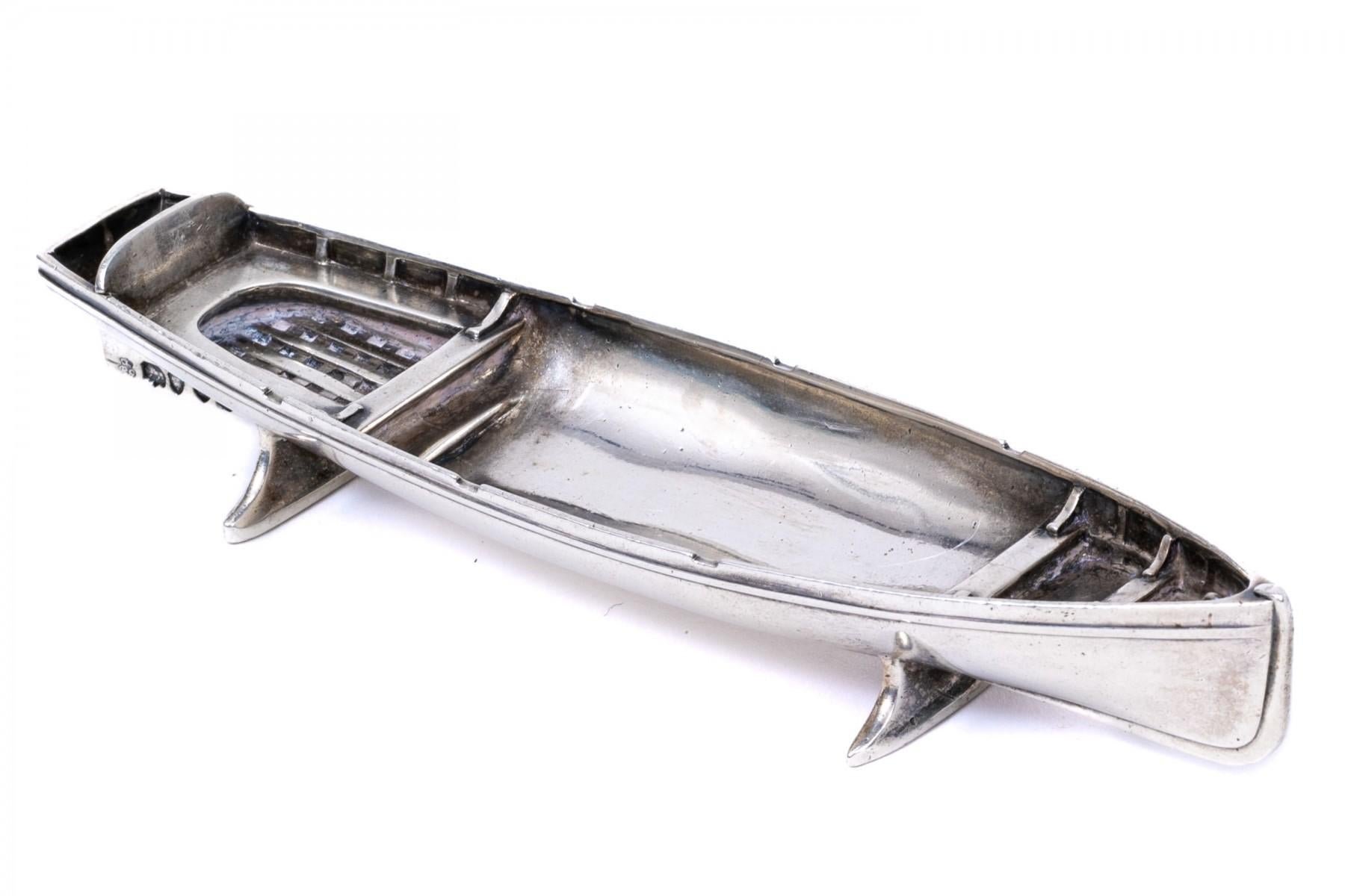 Antique sterling silver boat by Robert Garard II circa 1878. This magnificent diminutive lifeboat was made in London, England, by Robert Garard II, beautifully detailed and engraved 