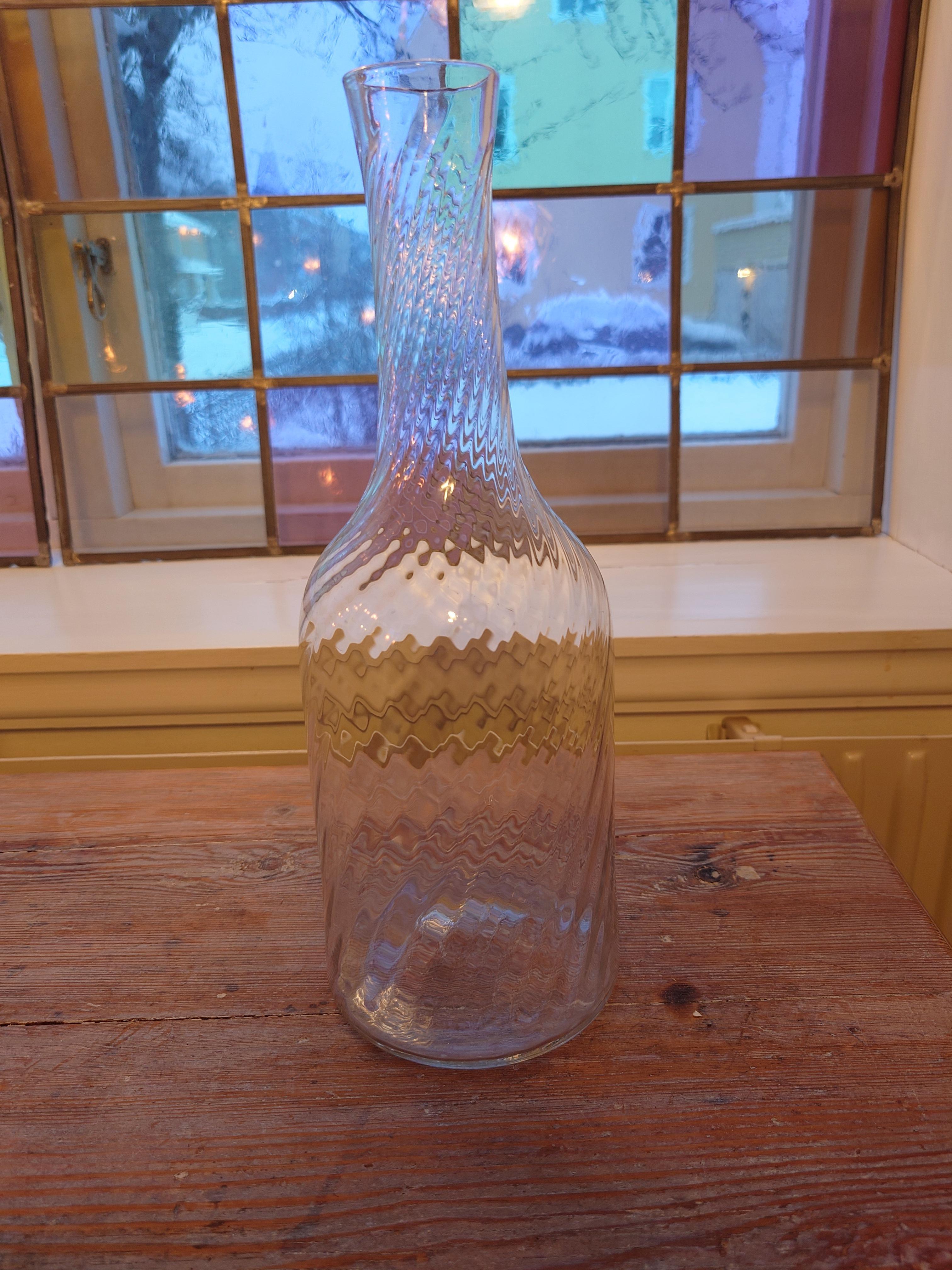A magnificent Swedish antique mouth blown twisted carafe from early 19th century.
A rare find.
A Centerpiece that brightens any table at any time.
 The carafe is intact without cracks or chips.
It is clear and nice in the glass.