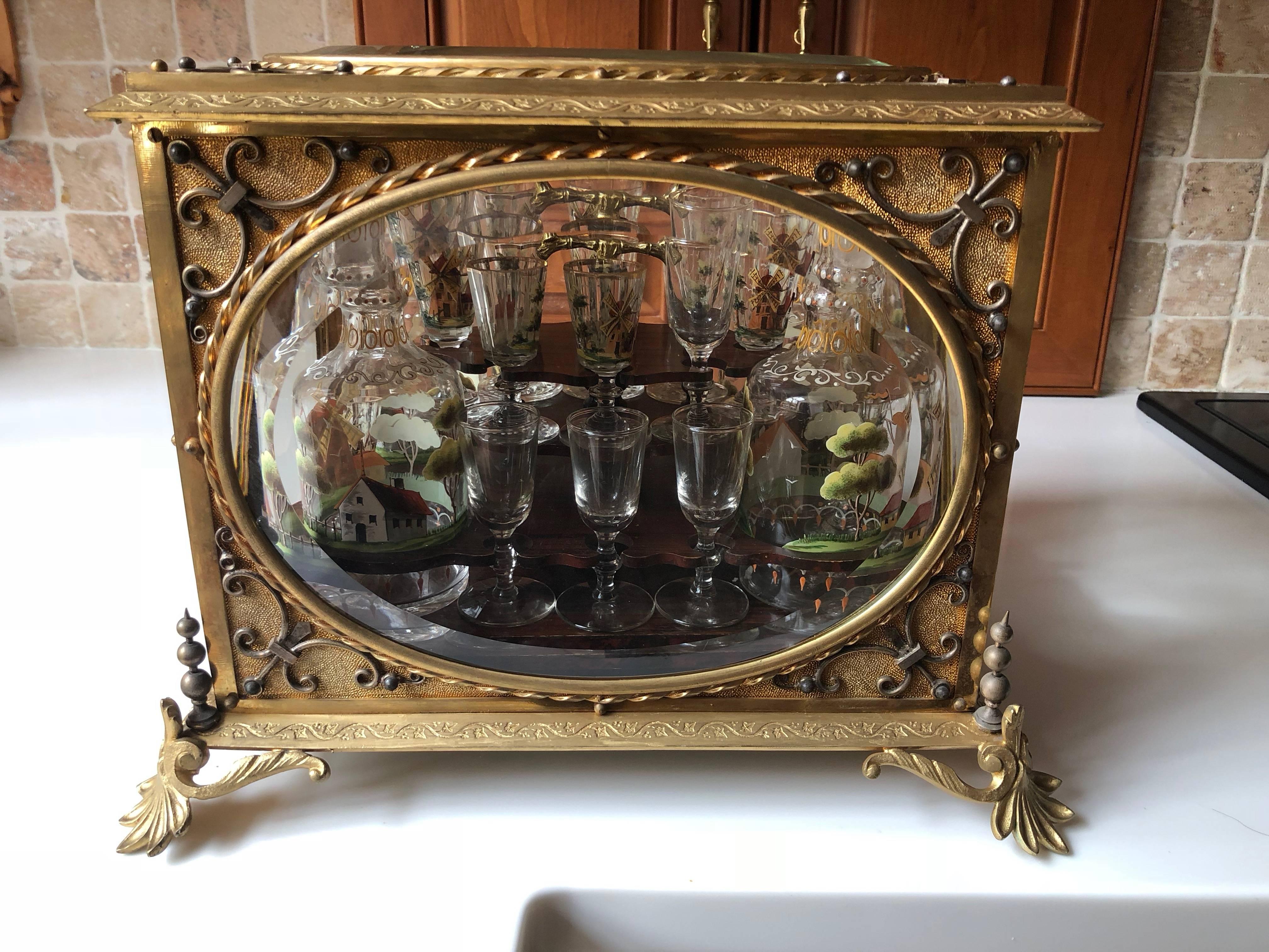Rare 19th century antique Tantalus, beautiful hand-painted glasses
Measures: 16 glasses 3 inches H
Eight bottles 8 inches H
Four glasses are not painted.