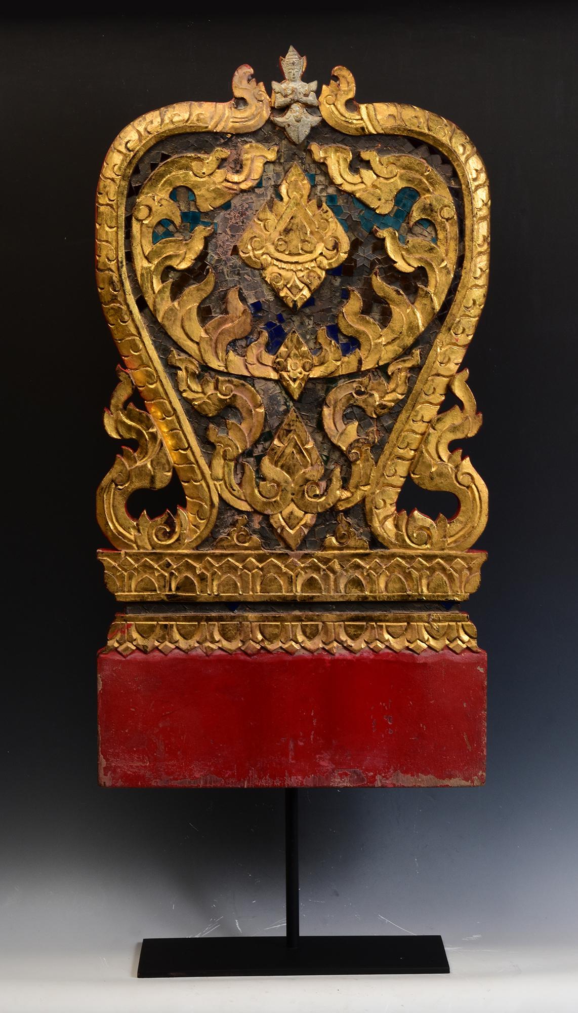 Antique Thai wood carving with angel, carved as Naga under leaf-shape, painted with lacquer and golden color, decorated with mirror-tiles, used for temple decoration.

Age: Thailand, 19th Century
Size: Height 71.4 C.M. / Width 37.8 C.M. / Thickness