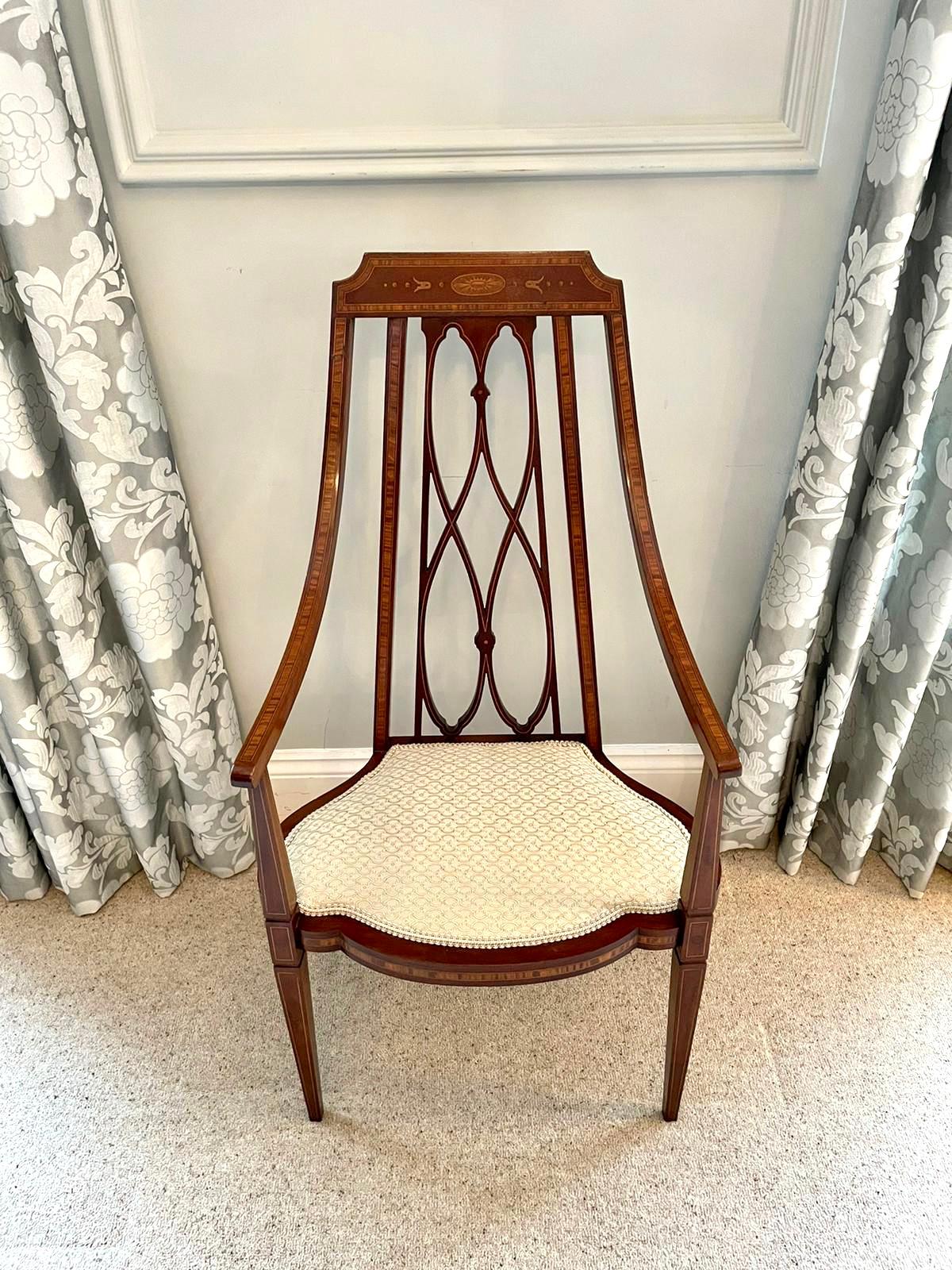 Unusual 19th century antique Victorian inlaid mahogany armchair having an appealing shaped top rail with satinwood inlay and unusual pretty shaped open arms with satinwood inlay. The shaped pierced centre splat has been beautifully inlaid also in