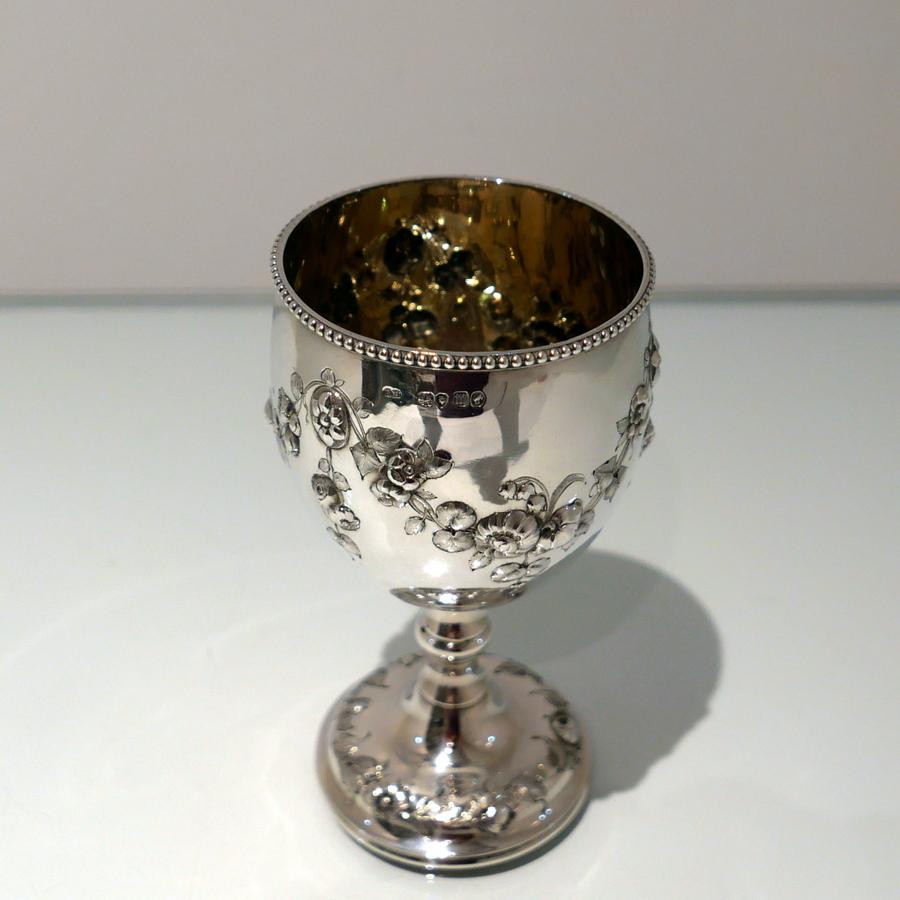 A fine quality Victorian silver wine goblet made by the highly renowned silversmith Robert Harper.The bowl has a stylish upper bead wire and lower embellishments of elegant floral hanging garlands. The raised pedestal foot is circular and has