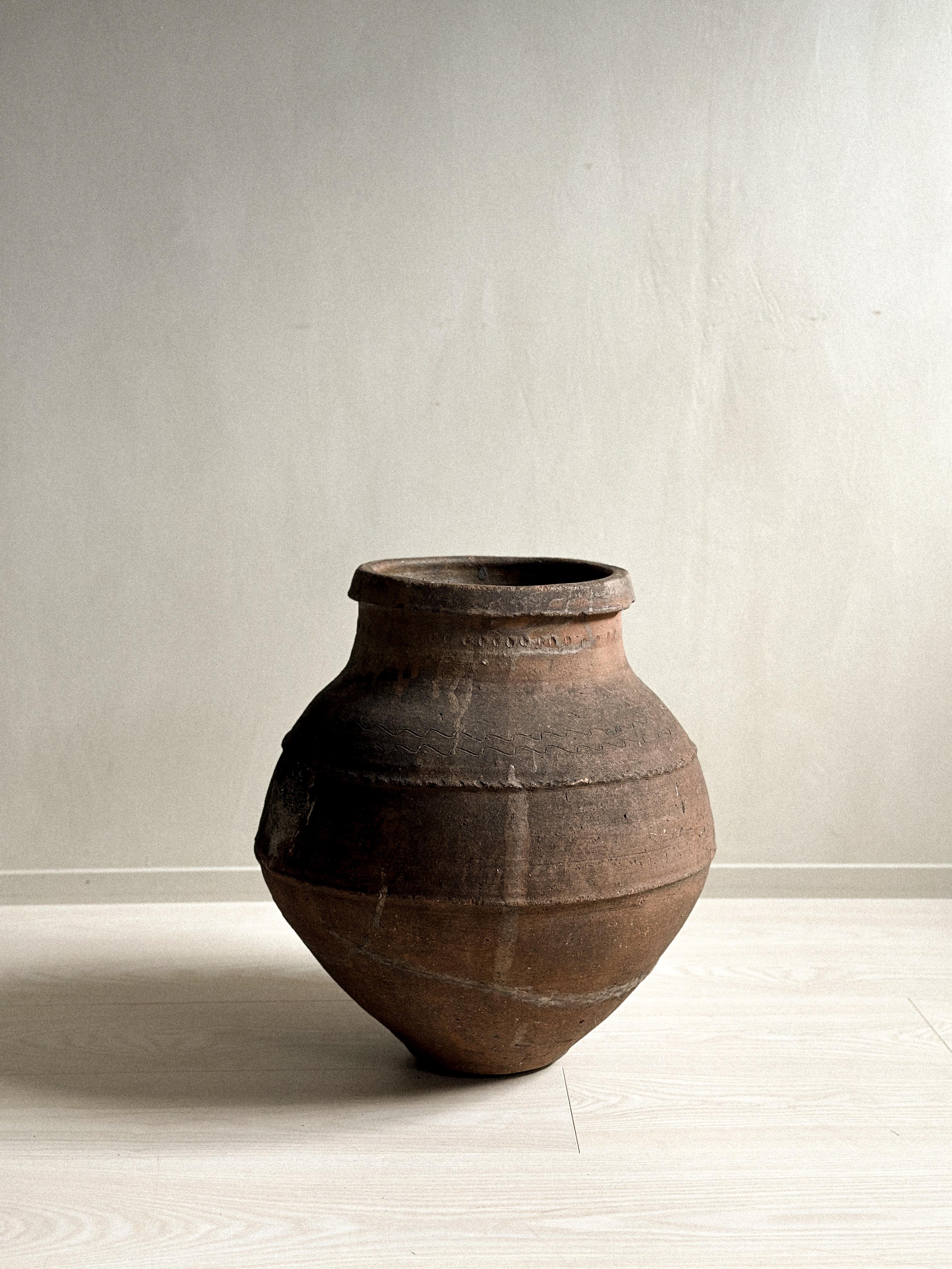 A wonderful antique wabi sabi pot with beautiful patina from age and use. 