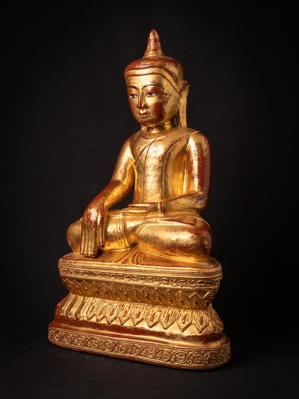 The antique wooden Burmese Buddha statue is a remarkable and historically significant artifact originating from Burma. Crafted from wood, this statue stands at an impressive 64 cm in height and measures 39.5 cm in width and 24 cm in depth. Adorned