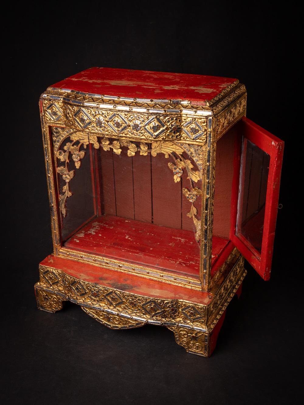 This 19th-century wooden Burmese Buddha temple is a stunning testament to the rich spiritual and artistic heritage of Burma. Crafted from wood and standing at a height of 52.5 cm, with dimensions of 43.7 cm in width and 28 cm in depth, it radiates a