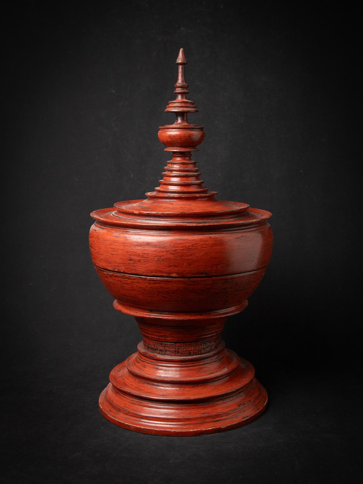 The Antique wooden Burmese offering vessel is a remarkable and culturally significant artifact originating from Burma. Crafted from wood, this offering vessel stands at 67 cm in height and has a diameter of 33,5 cm. Enhancing its visual appeal and